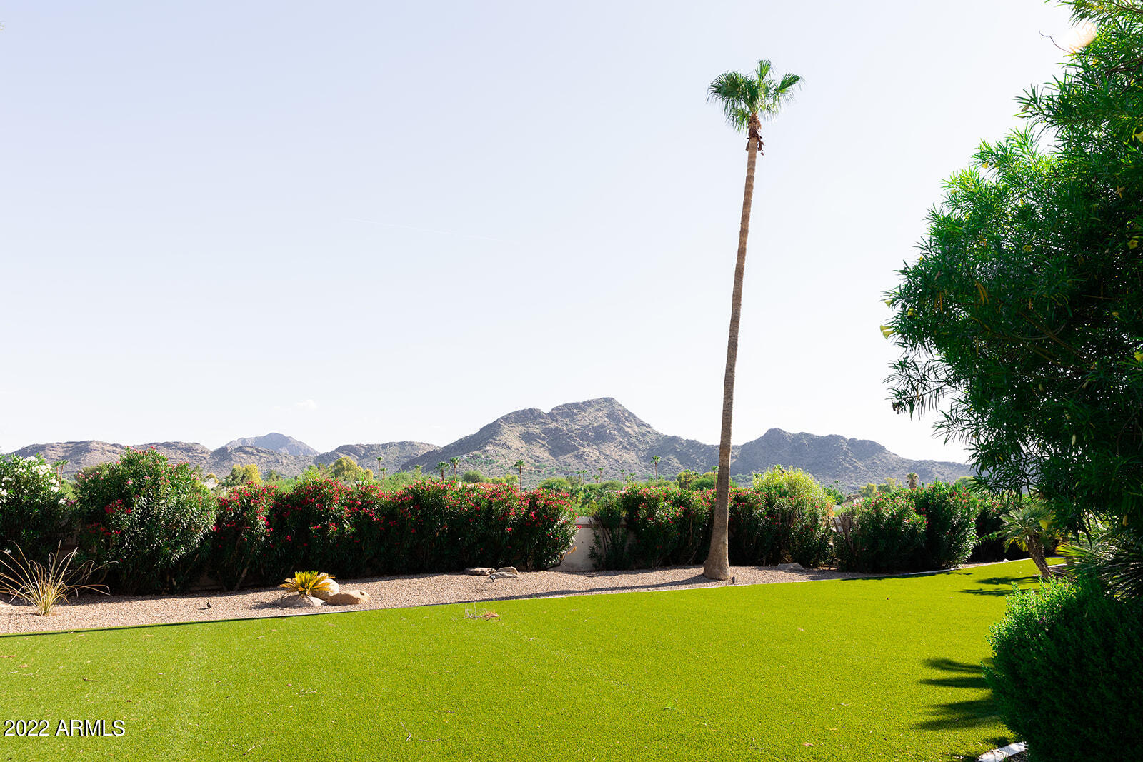 6271 East Horseshoe Road Paradise Valley, AZ 85253 - Photo 16 of 16 a view of green field with mountains in the background