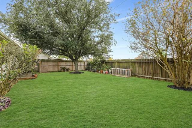 a view of a backyard with a garden