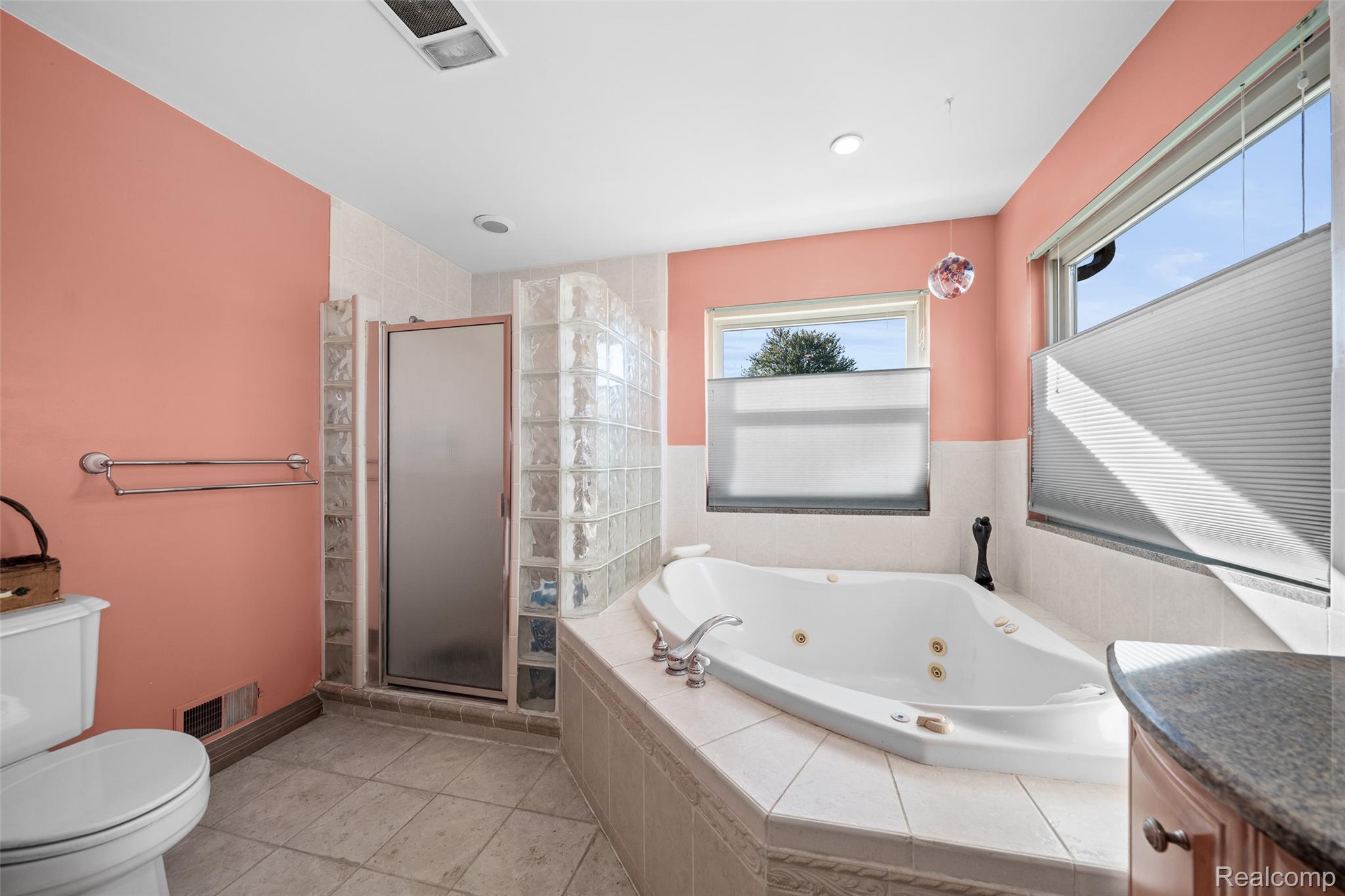 7214 Cardinal Road Algonac, MI 48001 - Photo 7 of 51 Bathroom with a shower stall, a whirlpool tub, vanity, and light tile patterned flooring
