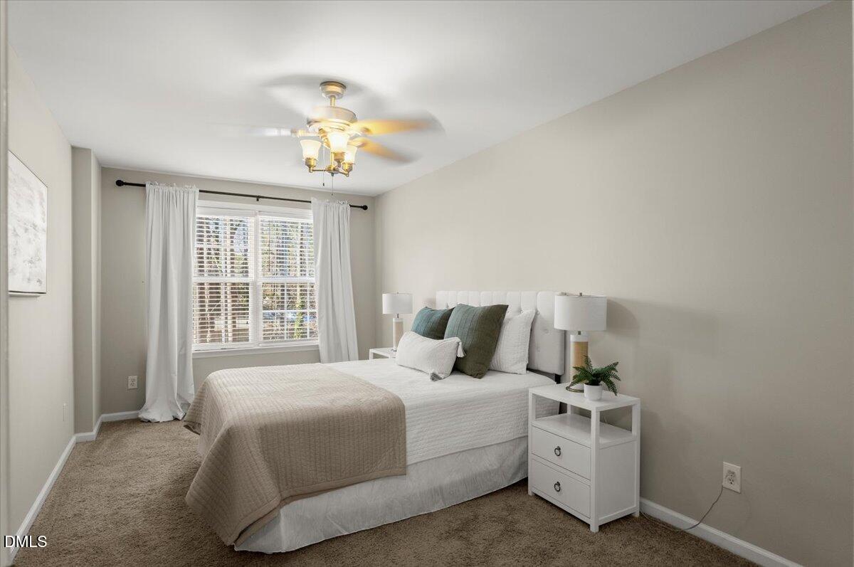 2920 Barrymore Street, Unit 106 Raleigh, NC 27603 - Photo 13 of 31 a bedroom with a bed and a window