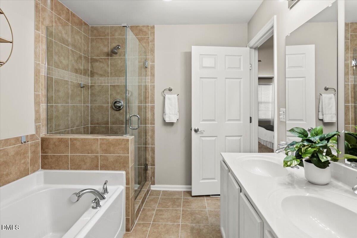 2920 Barrymore Street, Unit 106 Raleigh, NC 27603 - Photo 23 of 31 a bath tub sitting next to a white bath tub