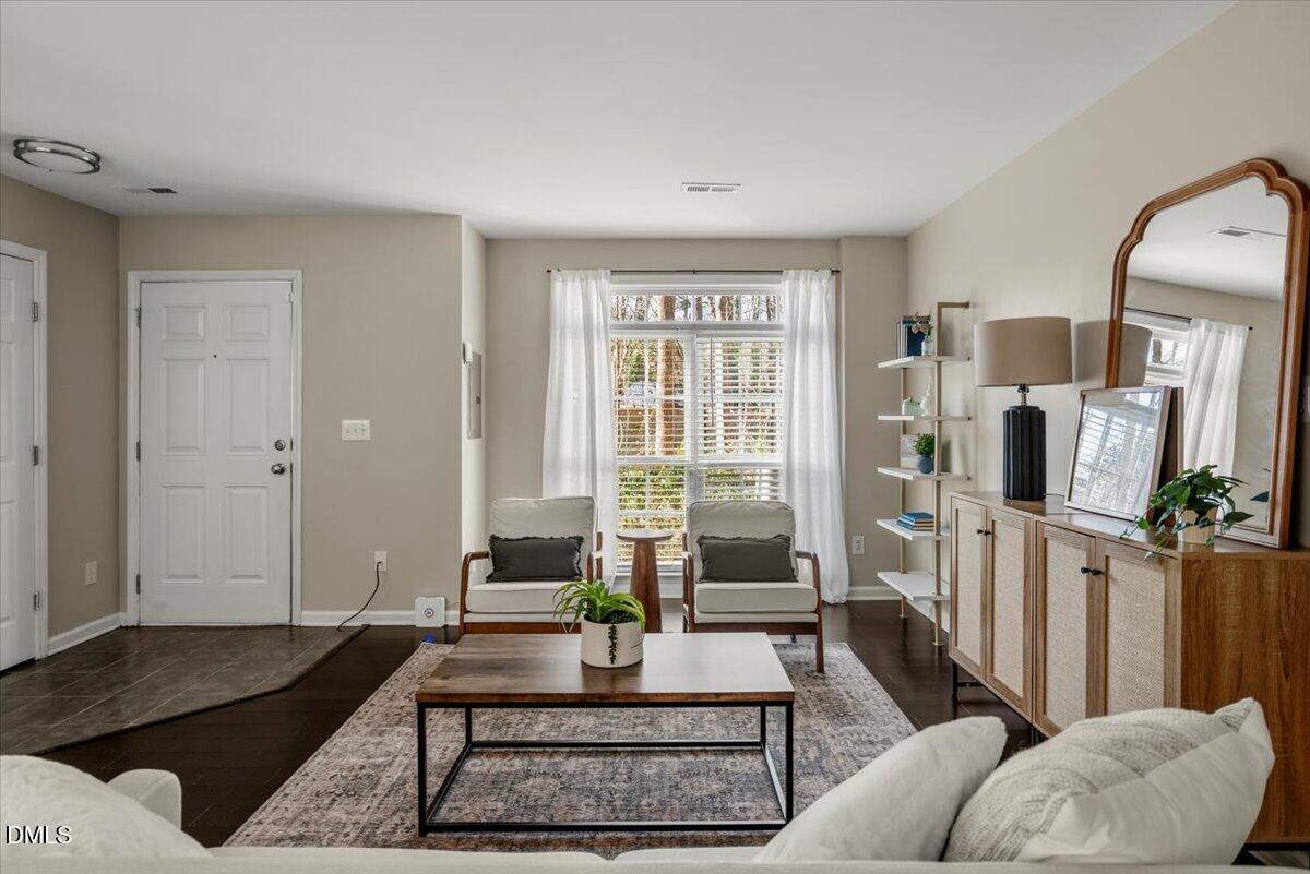 2920 Barrymore Street, Unit 106 Raleigh, NC 27603 - Photo 3 of 31 a living room with furniture and a window