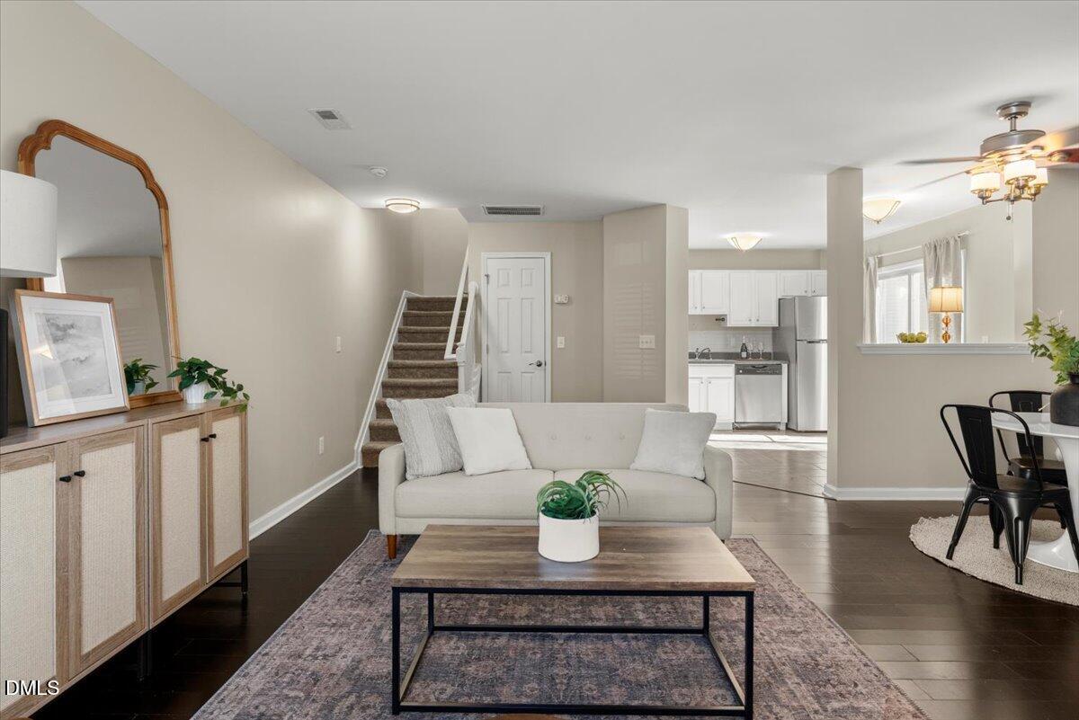 2920 Barrymore Street, Unit 106 Raleigh, NC 27603 - Photo 5 of 31 a living room with furniture and wooden floor