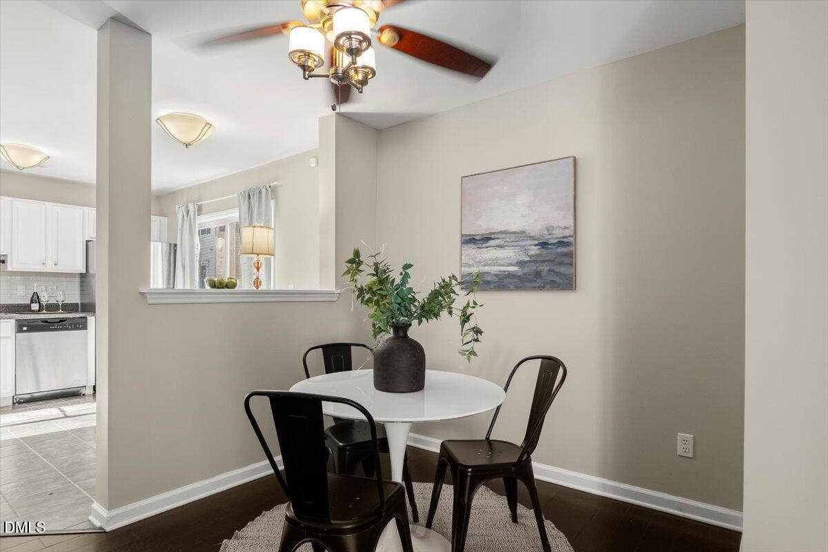 2920 Barrymore Street, Unit 106 Raleigh, NC 27603 - Photo 6 of 31 a dining room with furniture and chandelier
