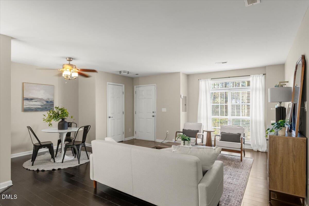 2920 Barrymore Street, Unit 106 Raleigh, NC 27603 - Photo 7 of 31 a living room with furniture and a potted plant