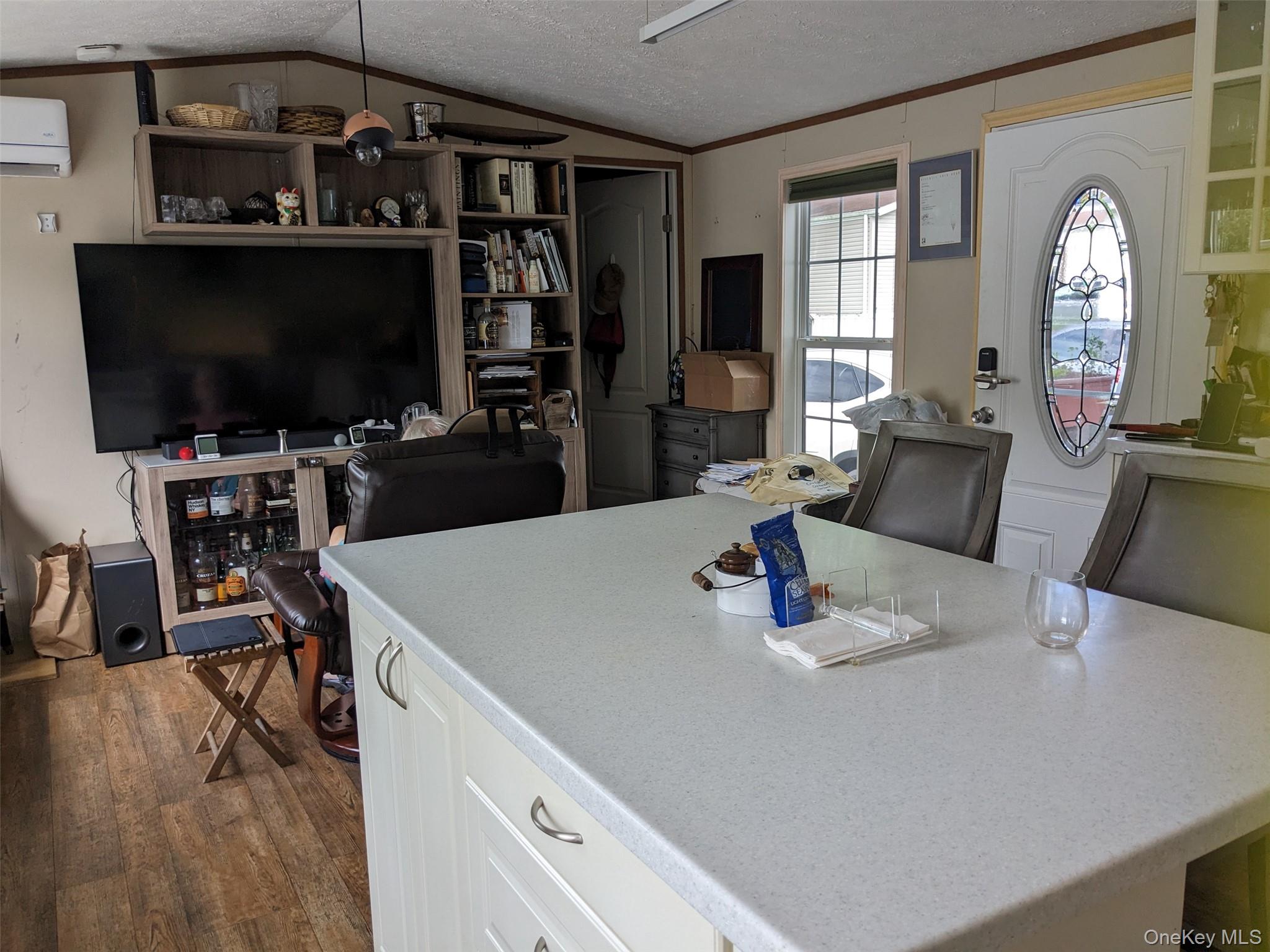 4 Treeline Circle, Unit 4 Cold Spring, NY 10516 - Photo 7 of 16 a kitchen with a table chairs and a flat screen tv