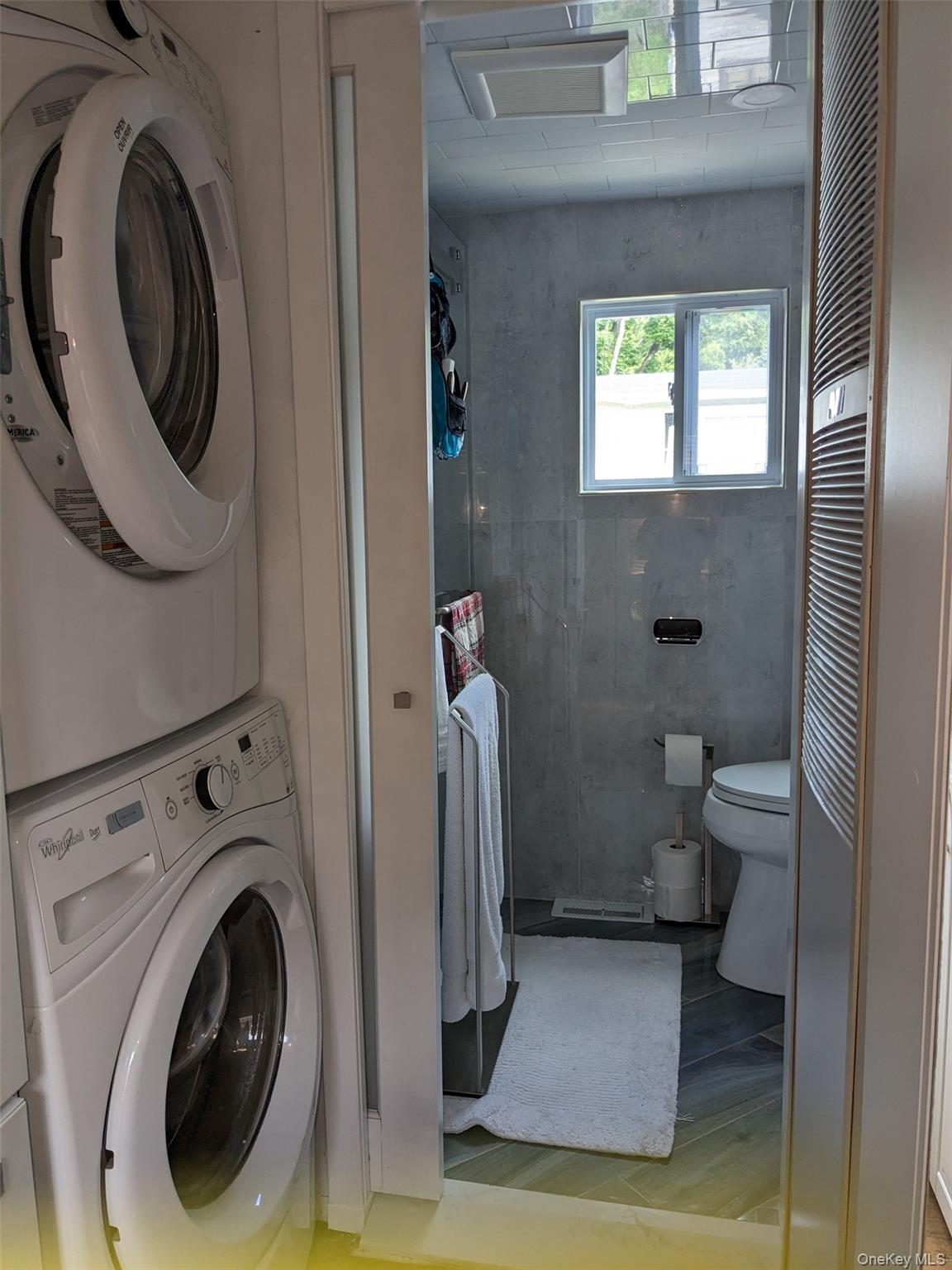 4 Treeline Circle, Unit 4 Cold Spring, NY 10516 - Photo 10 of 16 a view of a bathroom with washing machine and toilet