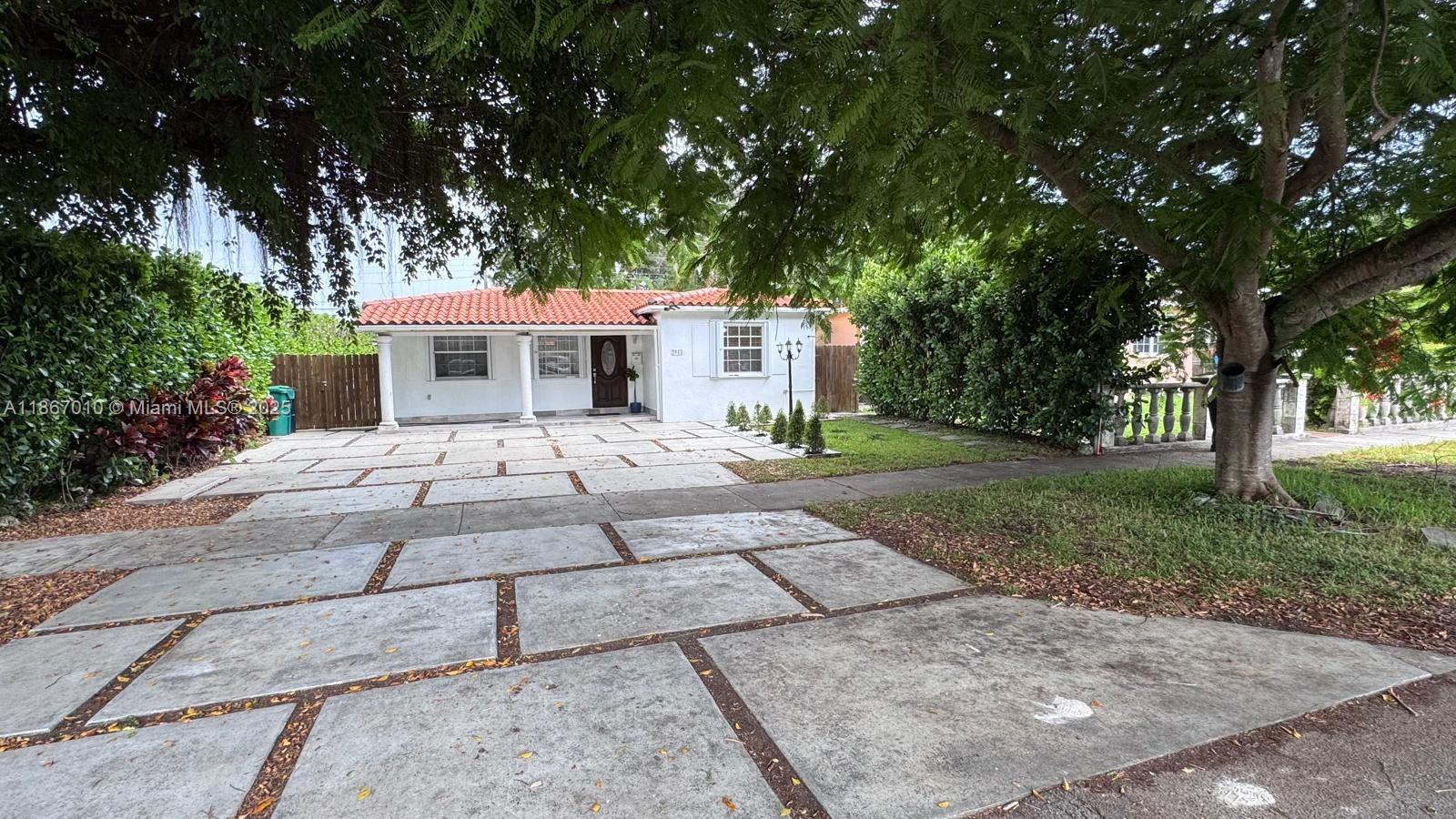 front view of a house with a yard