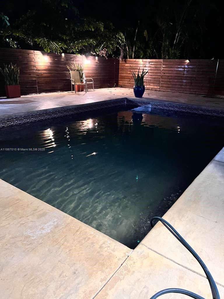 3911 Southwest 61st Avenue Miami, FL 33155 - Photo 11 of 38 a view of swimming pool from a balcony