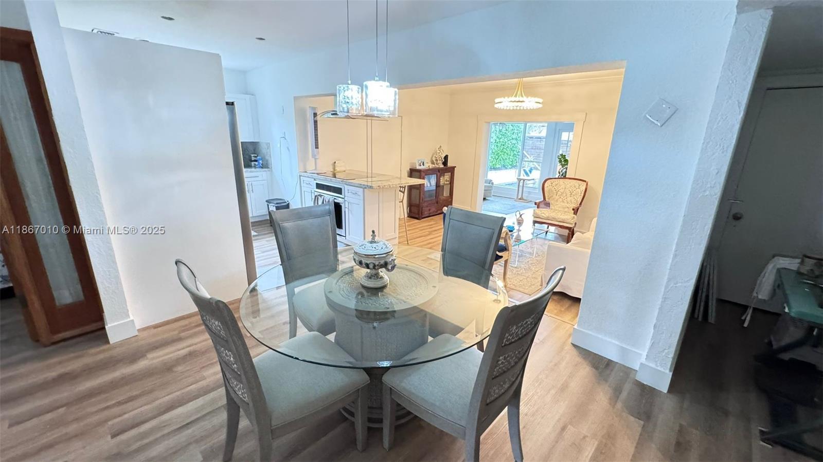 3911 Southwest 61st Avenue Miami, FL 33155 - Photo 17 of 38 a view of a dining room with furniture and wooden floor