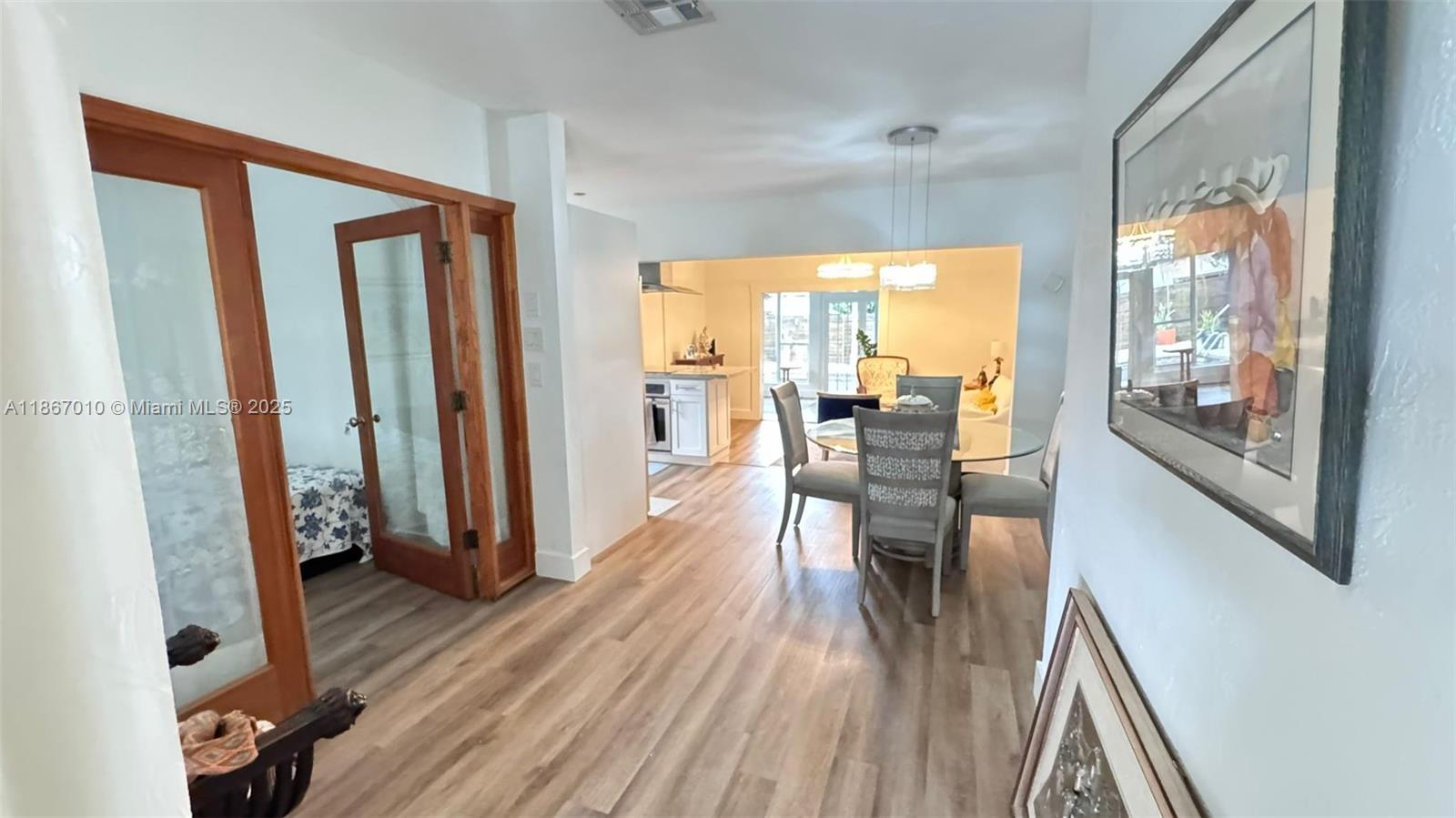 3911 Southwest 61st Avenue Miami, FL 33155 - Photo 18 of 38 a view of a dining room with furniture and wooden floor