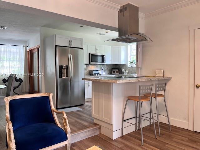 3911 Southwest 61st Avenue Miami, FL 33155 - Photo 26 of 38 a kitchen with stainless steel appliances granite countertop a dining table chairs refrigerator and sink