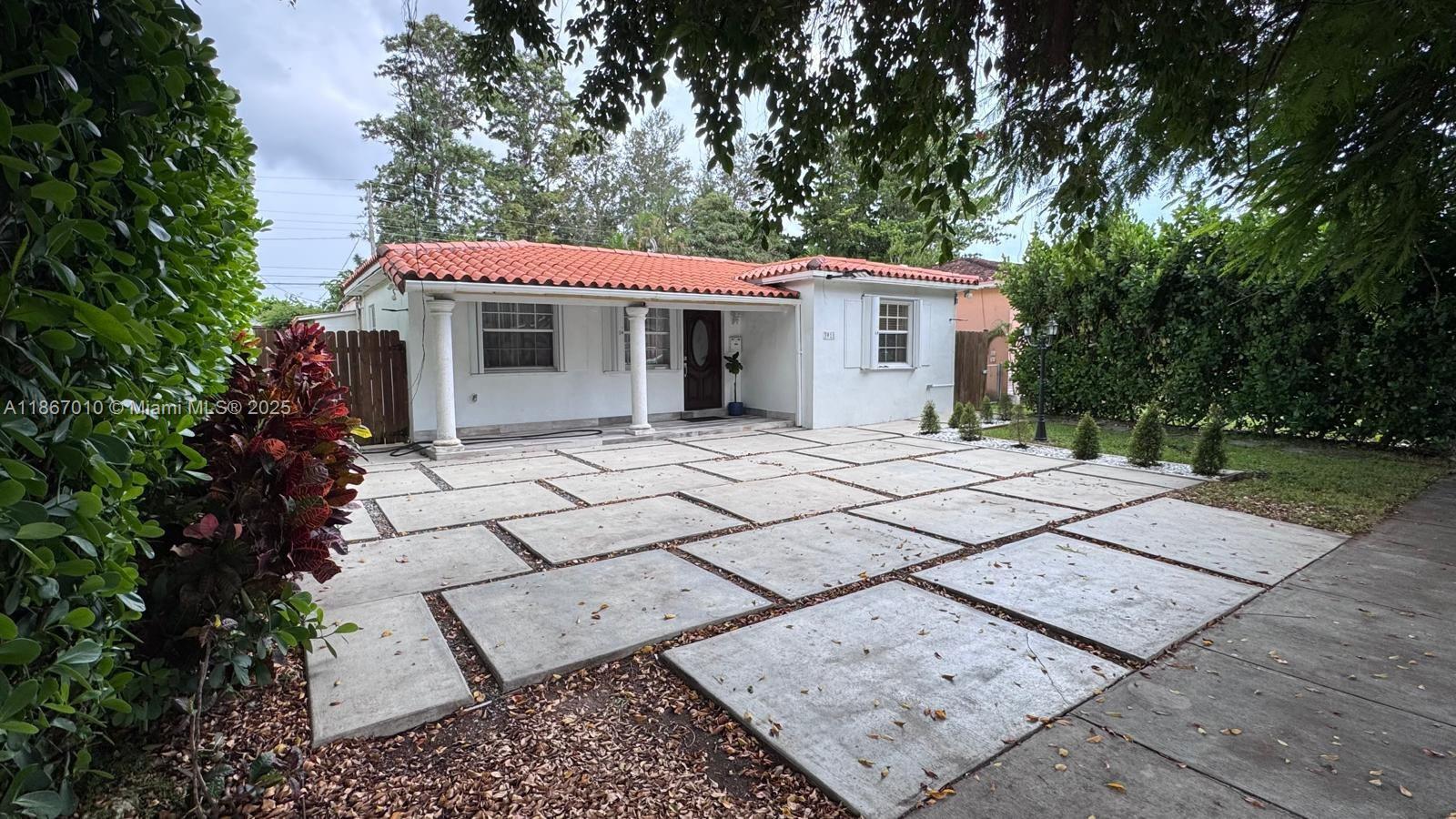 3911 Southwest 61st Avenue Miami, FL 33155 - Photo 3 of 38 a view of a house with a yard