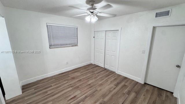 3911 Southwest 61st Avenue Miami, FL 33155 - Photo 33 of 38 wooden floor in an empty room with a window