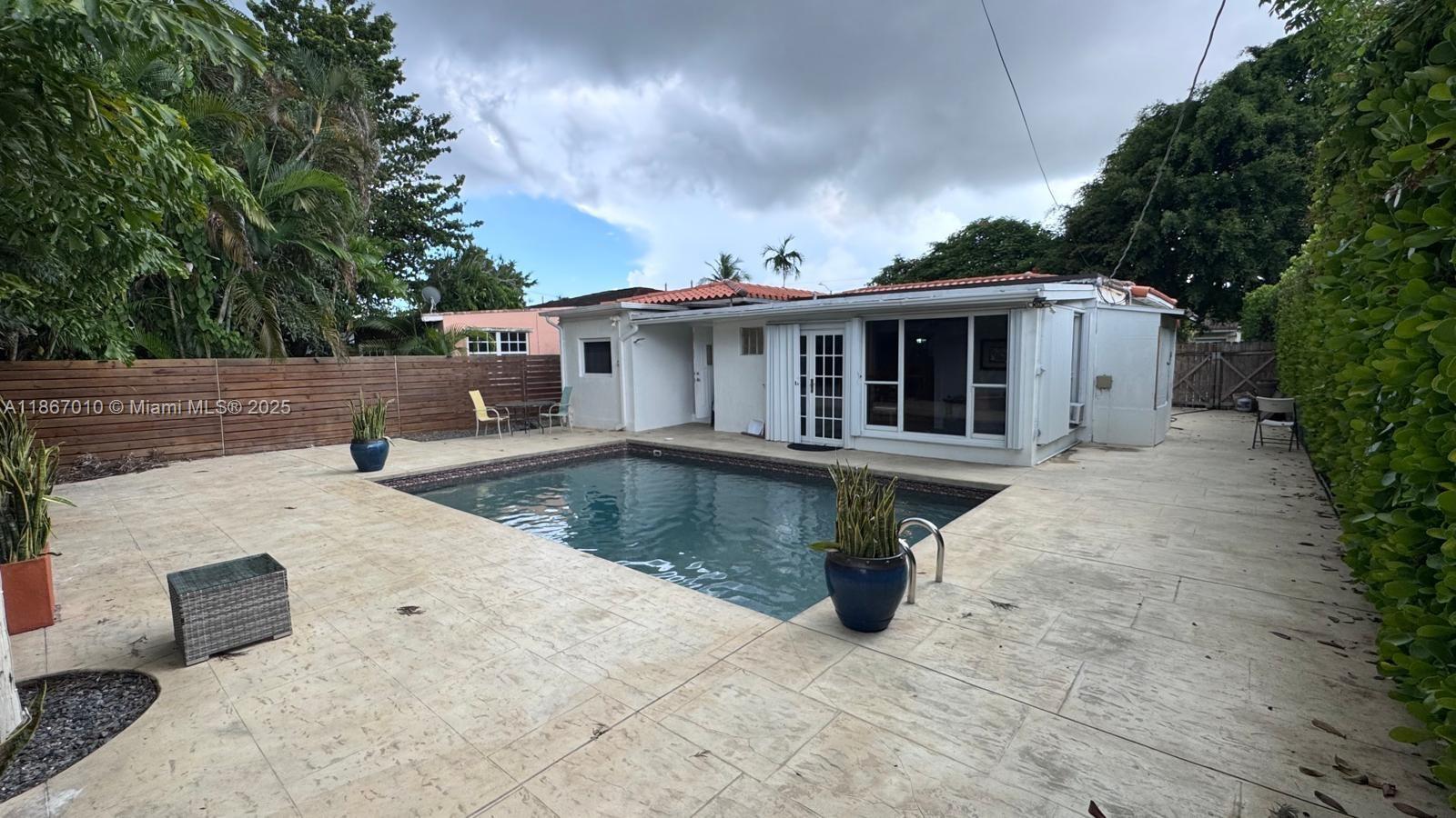 3911 Southwest 61st Avenue Miami, FL 33155 - Photo 8 of 38 a view of a house with pool