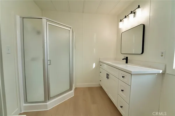 a bathroom with 2 sink and a mirror