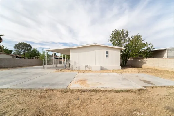 a view of a house with a yard and garage