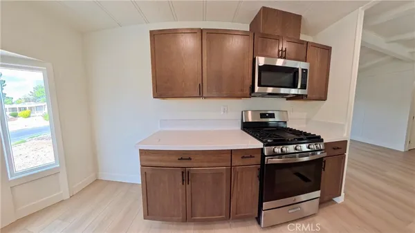 a kitchen with a stove and a microwave