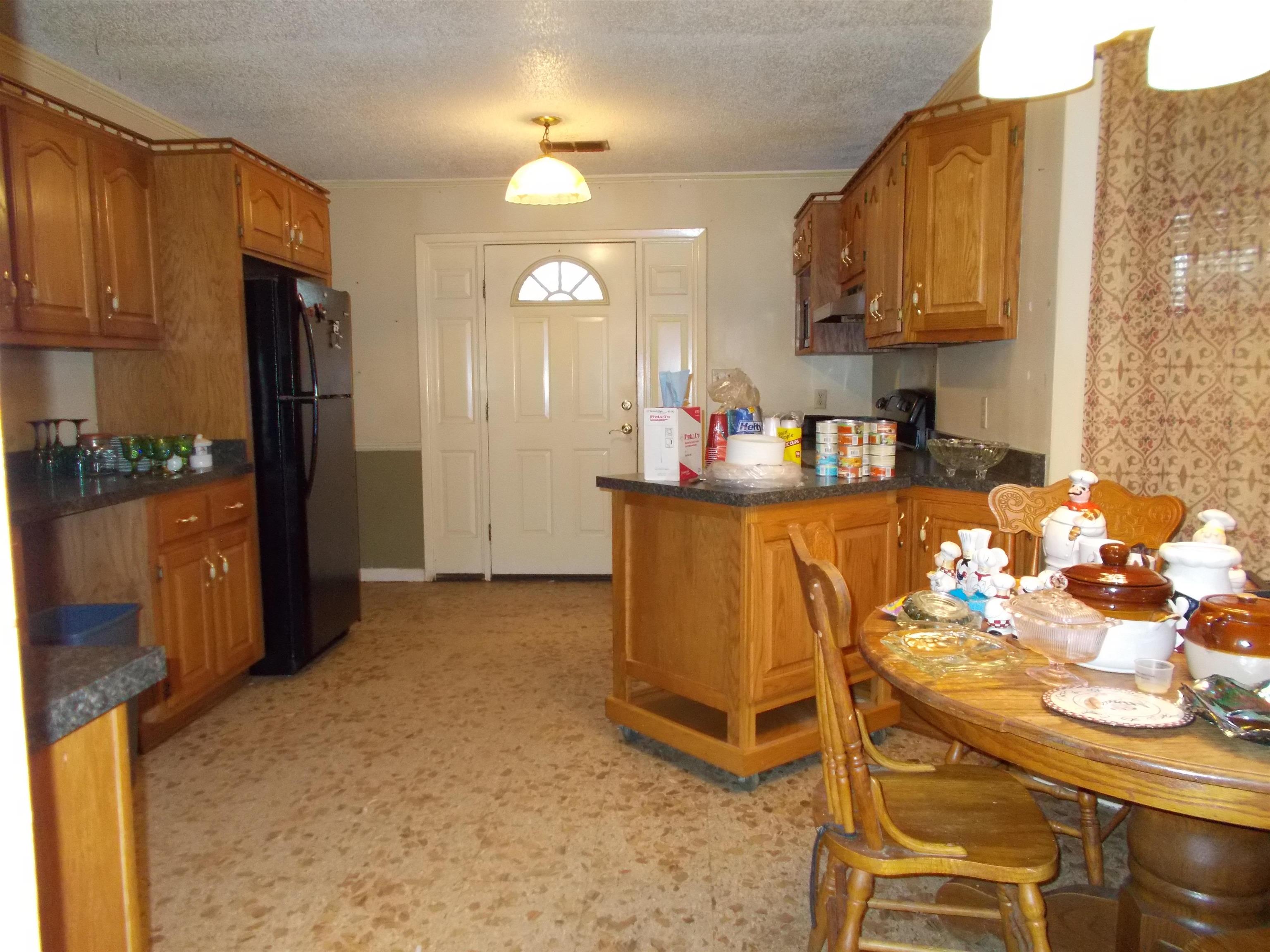 1058 Thumb Road Henning, TN 38041 - Photo 11 of 25 a kitchen with a sink and cabinets