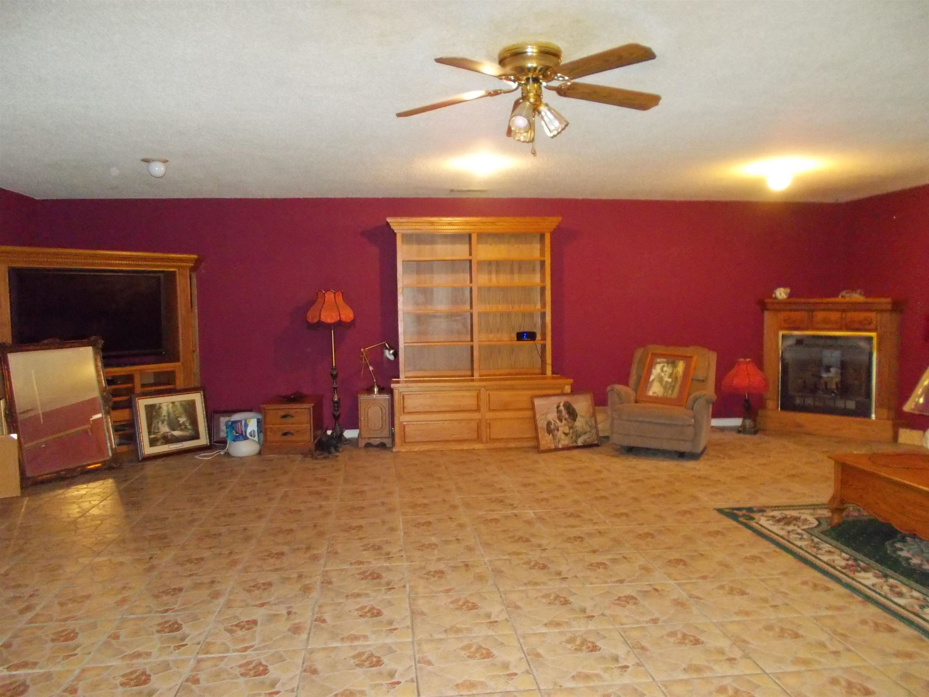 1058 Thumb Road Henning, TN 38041 - Photo 13 of 25 a living room with furniture and a fireplace