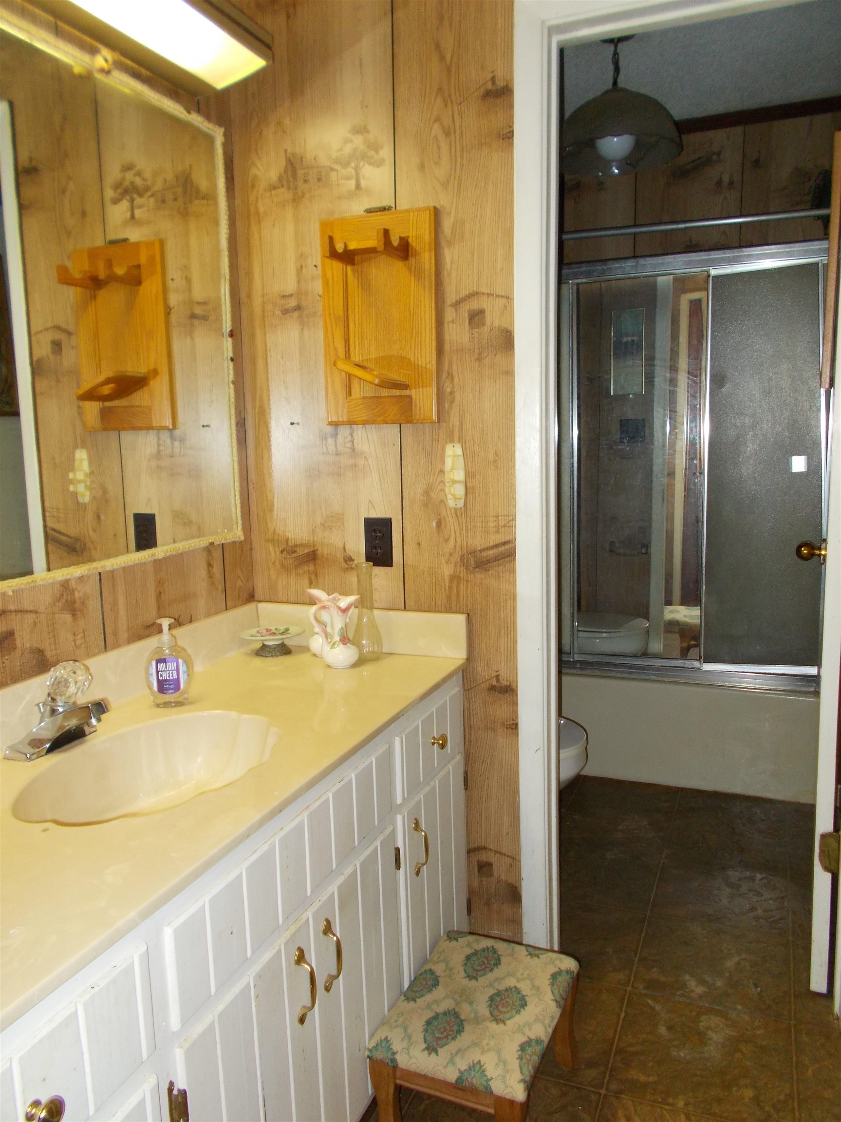 1058 Thumb Road Henning, TN 38041 - Photo 21 of 25 a bathroom with a double vanity sink mirror and shower