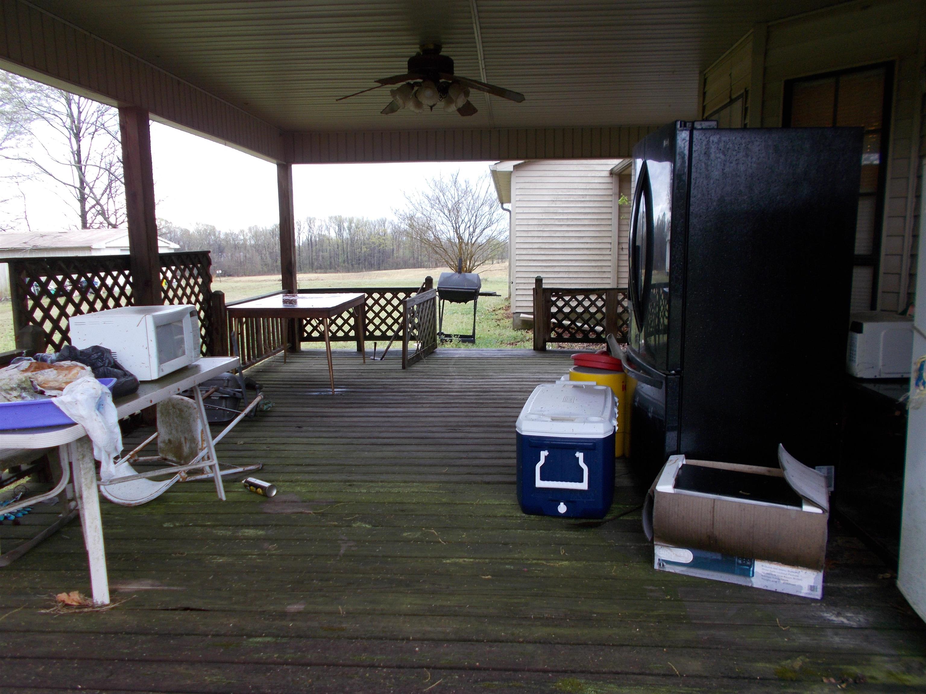 1058 Thumb Road Henning, TN 38041 - Photo 23 of 25 a living room with furniture and a floor to ceiling window