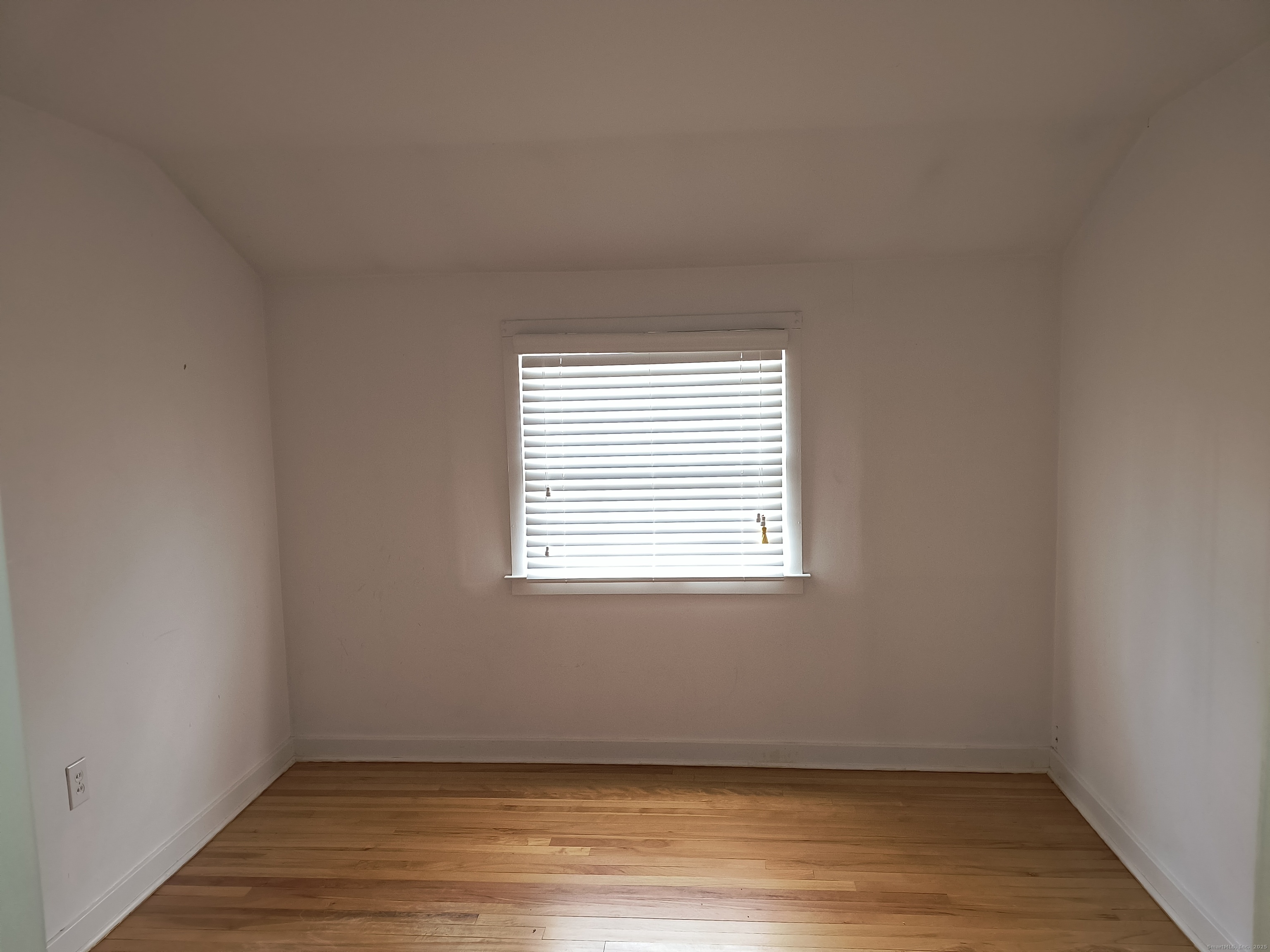 28 McLaughlin Terrace Derby, CT 06418 - Photo 12 of 37 an empty room with wooden floor and windows