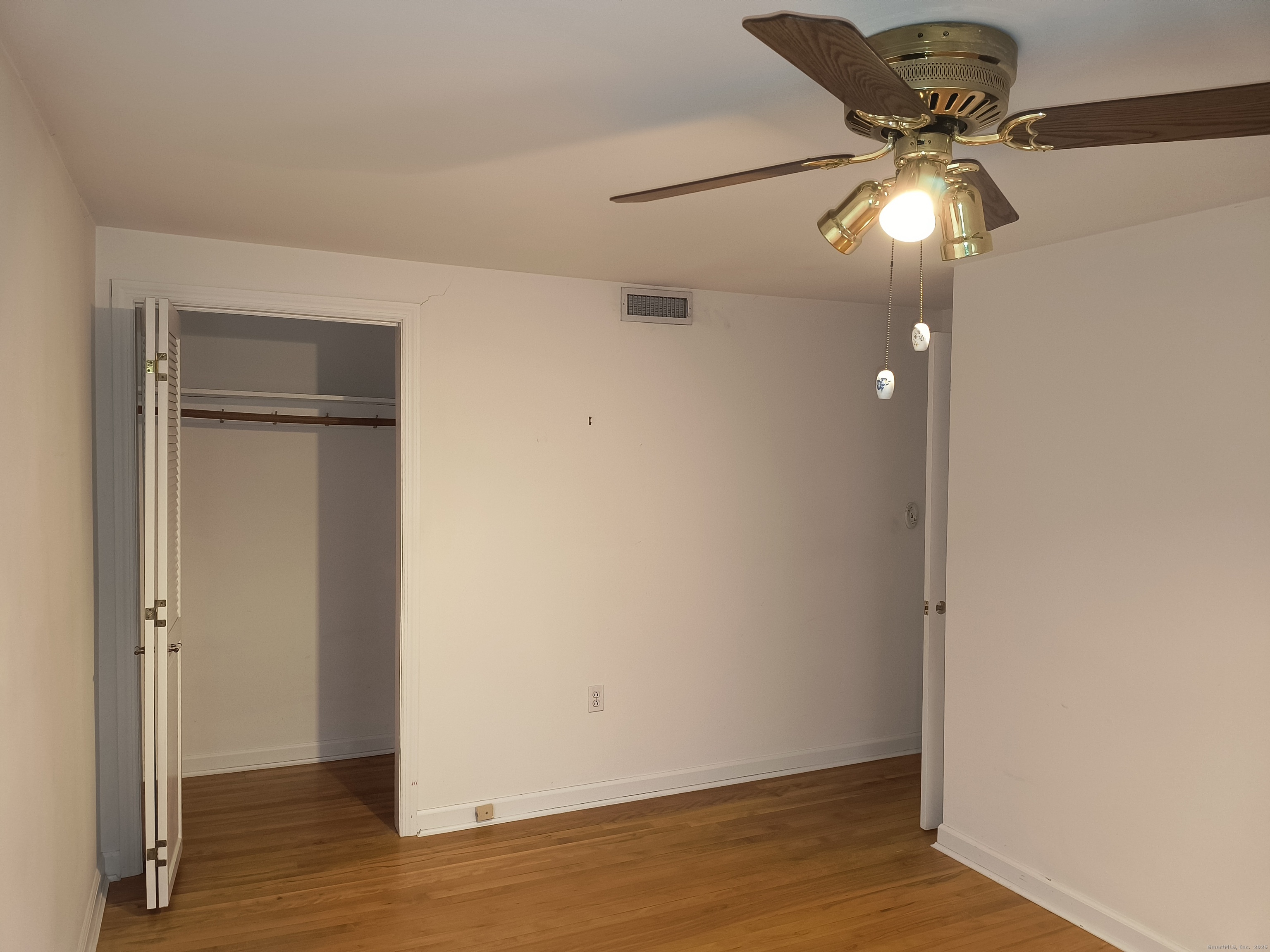 28 McLaughlin Terrace Derby, CT 06418 - Photo 15 of 37 an empty room with wooden floor closet and windows