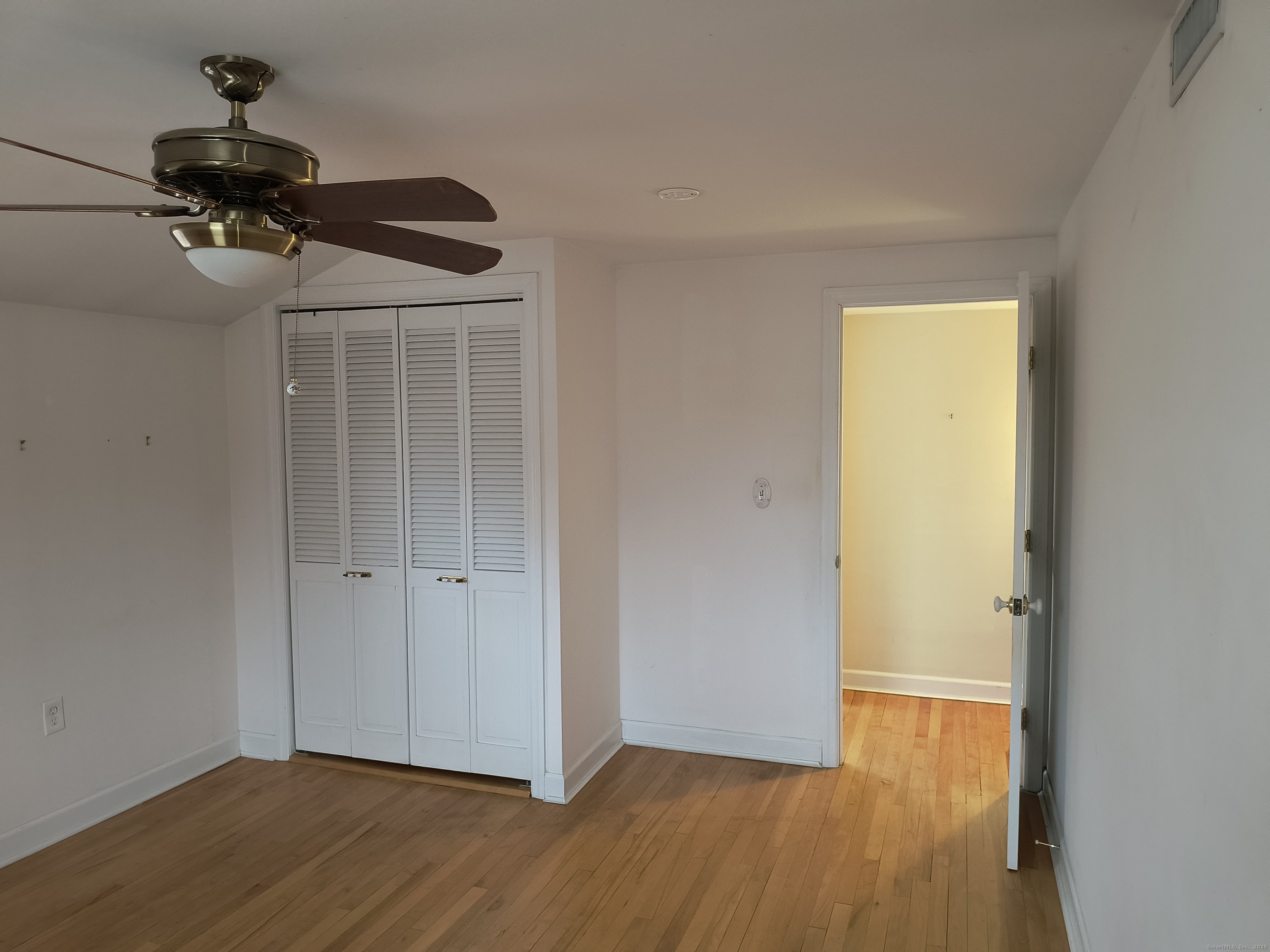 28 McLaughlin Terrace Derby, CT 06418 - Photo 17 of 37 a view of an empty room with wooden floor