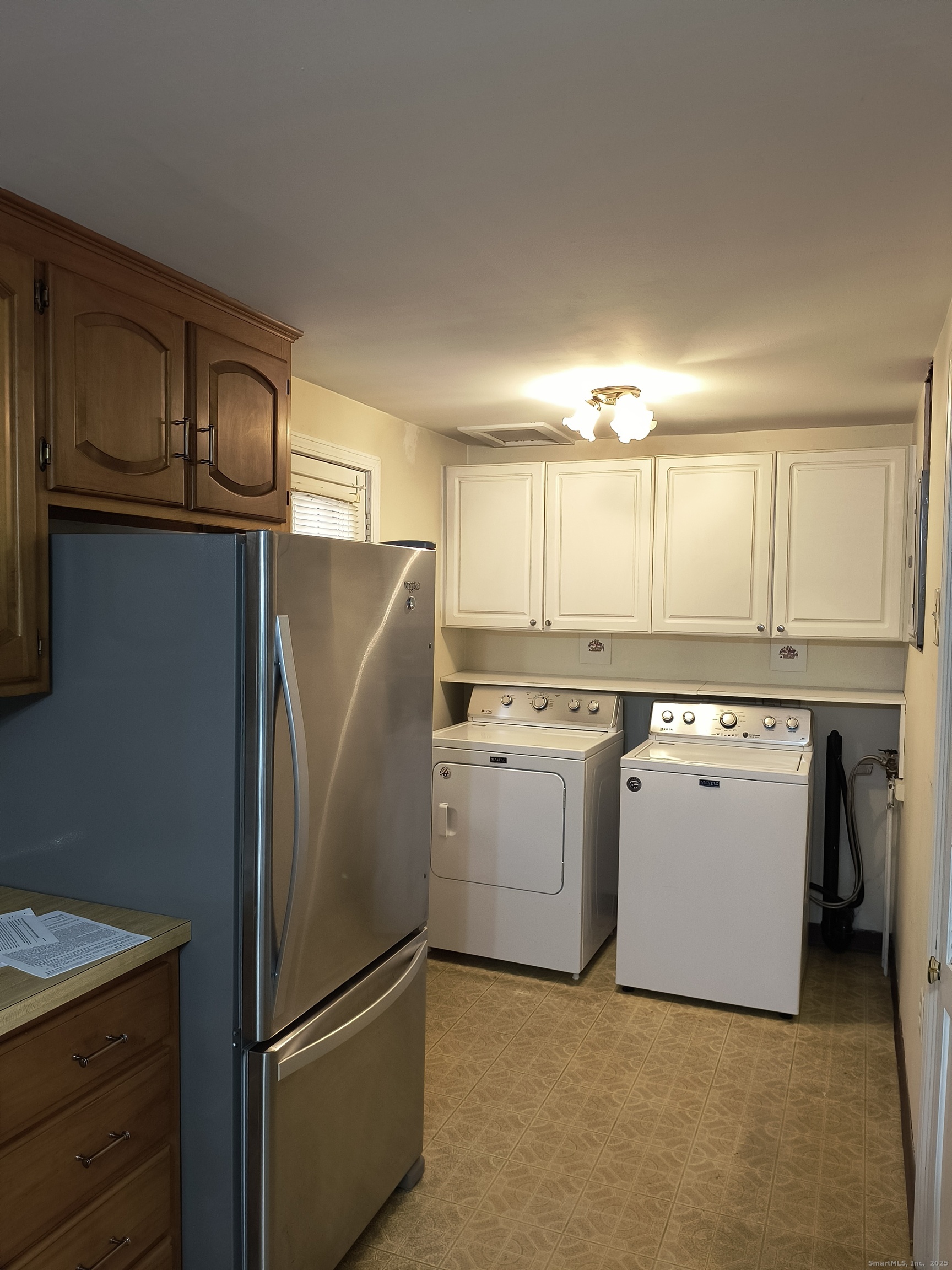 28 McLaughlin Terrace Derby, CT 06418 - Photo 24 of 37 a kitchen with a refrigerator sink and cabinets