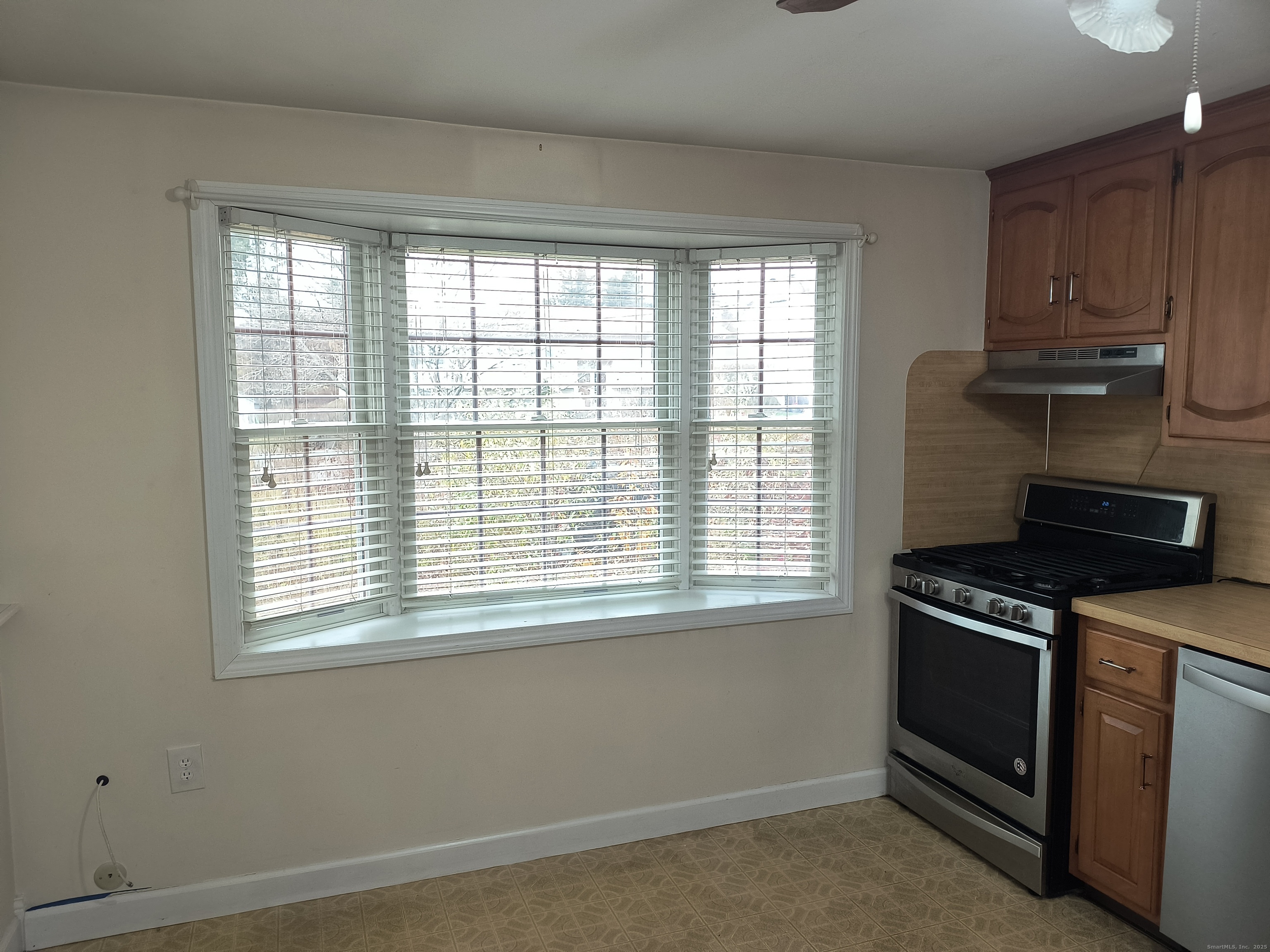 28 McLaughlin Terrace Derby, CT 06418 - Photo 28 of 37 a kitchen with a stove and a window