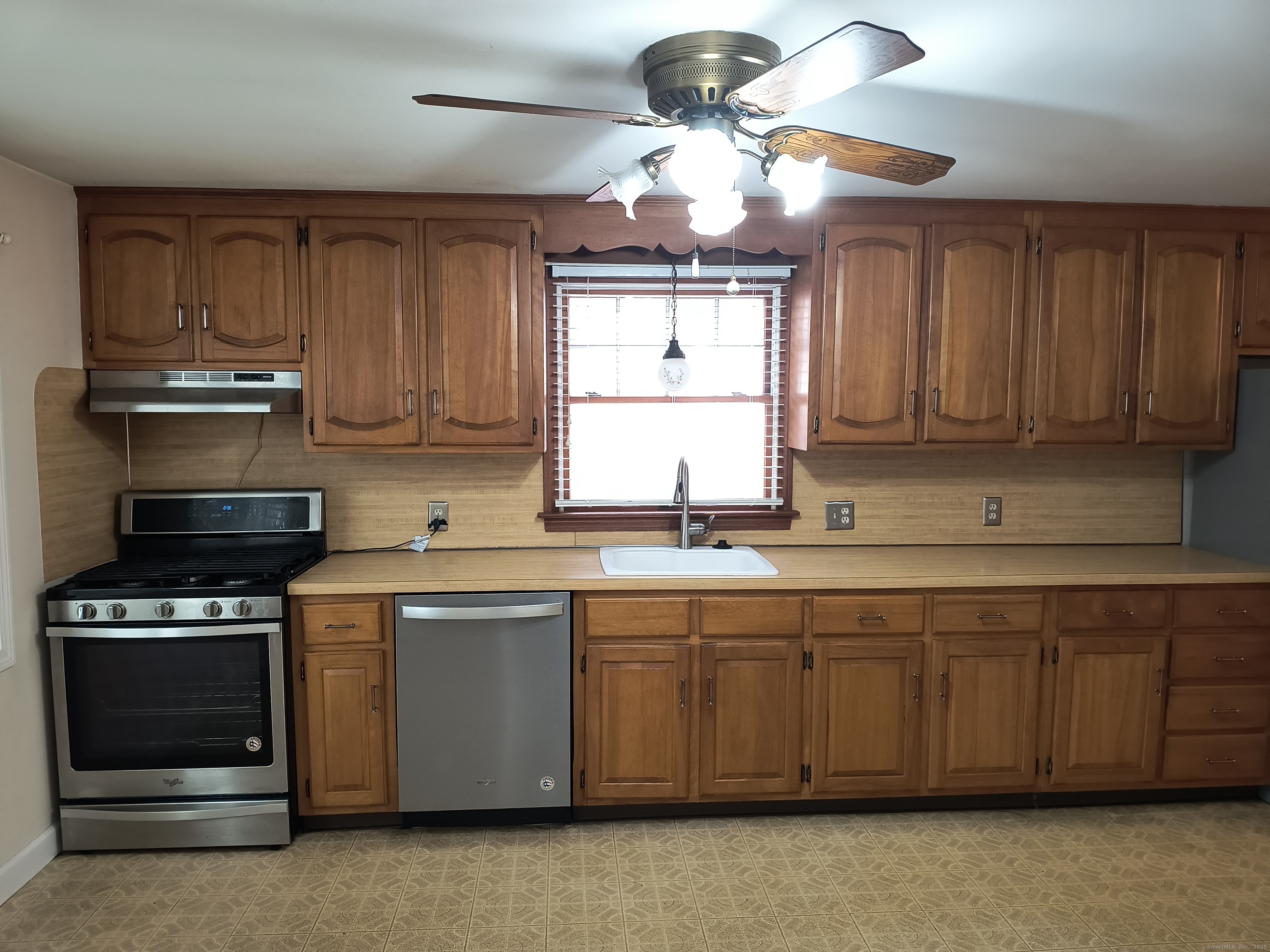 28 McLaughlin Terrace Derby, CT 06418 - Photo 30 of 37 a kitchen with stainless steel appliances a stove a sink and cabinets