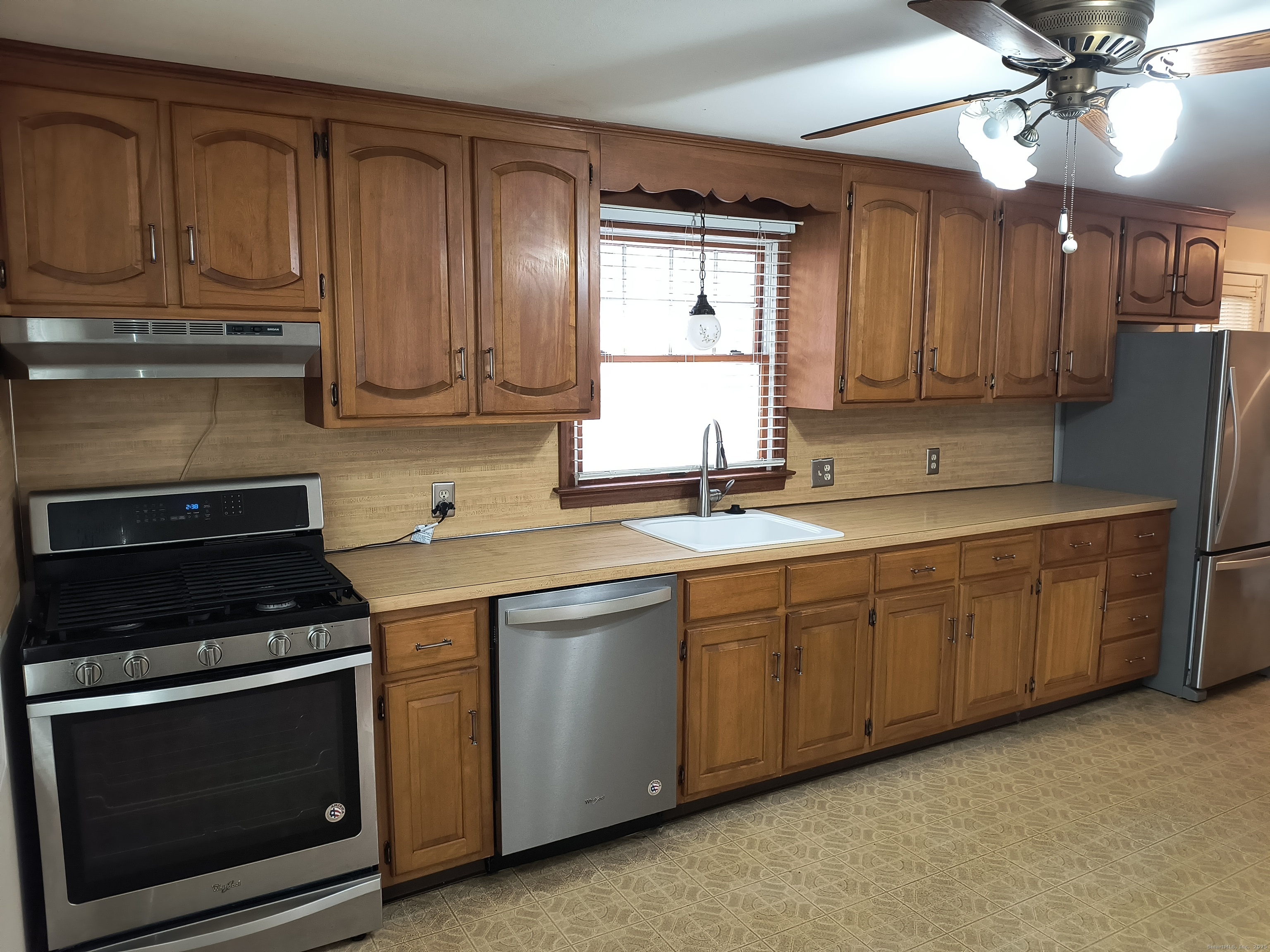 28 McLaughlin Terrace Derby, CT 06418 - Photo 31 of 37 a kitchen with stainless steel appliances granite countertop a stove a sink and a microwave