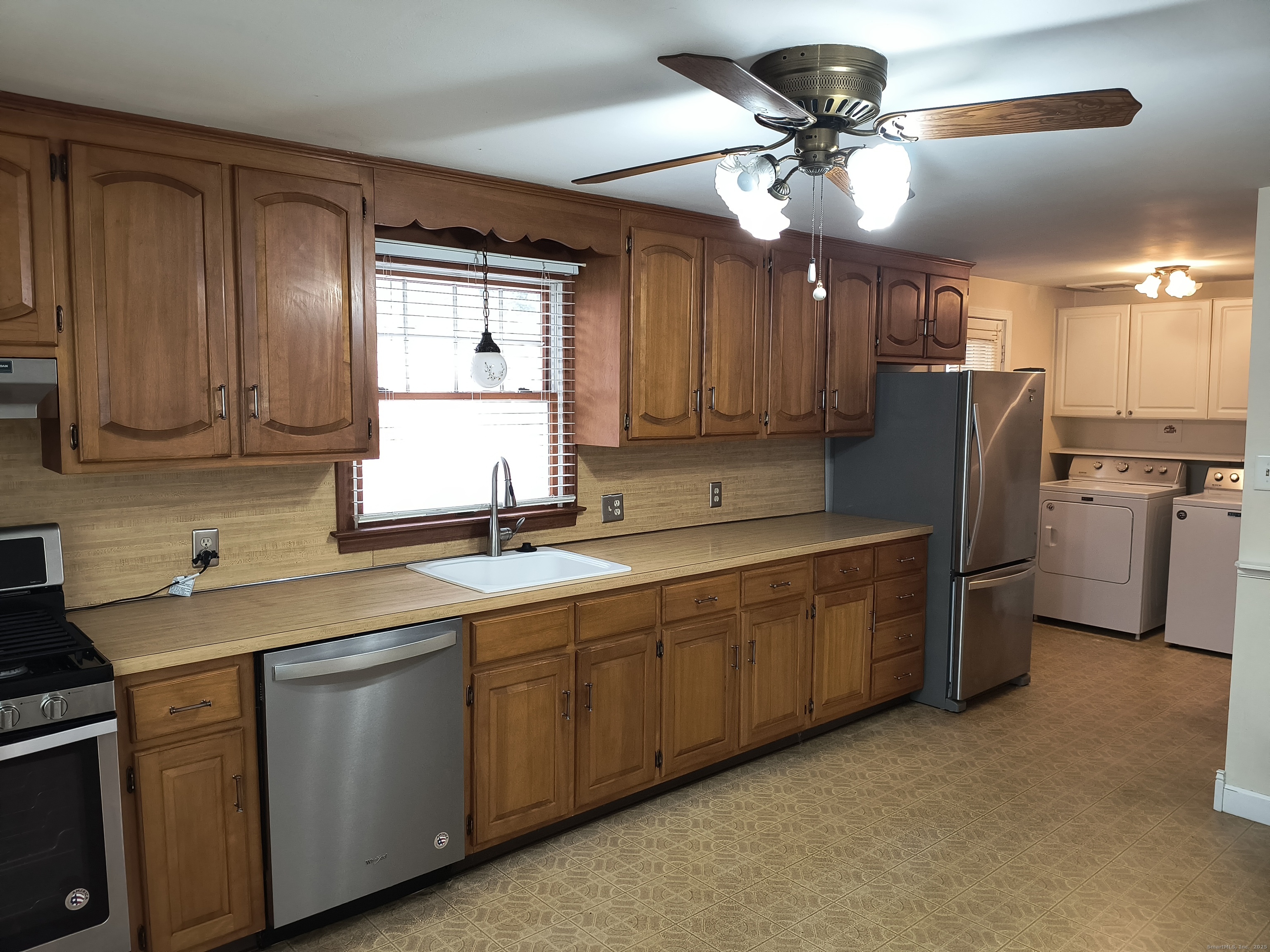 28 McLaughlin Terrace Derby, CT 06418 - Photo 32 of 37 a kitchen with sink cabinets and window
