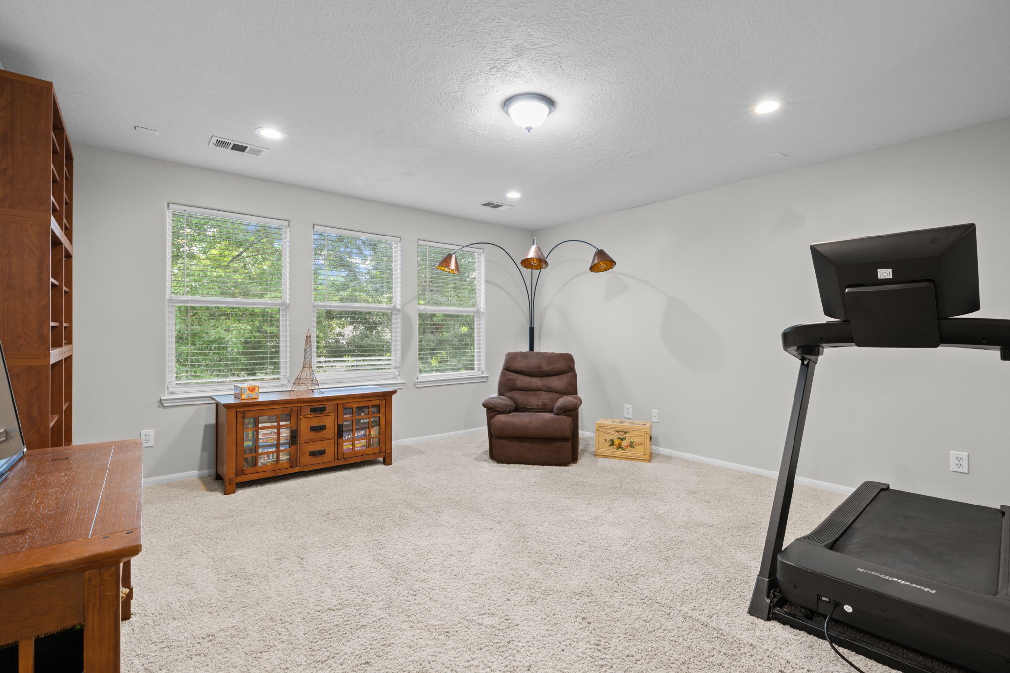 19114 Emory Trail Spring, TX 77388 - Photo 31 of 44 a spacious bedroom with a bed and a couch