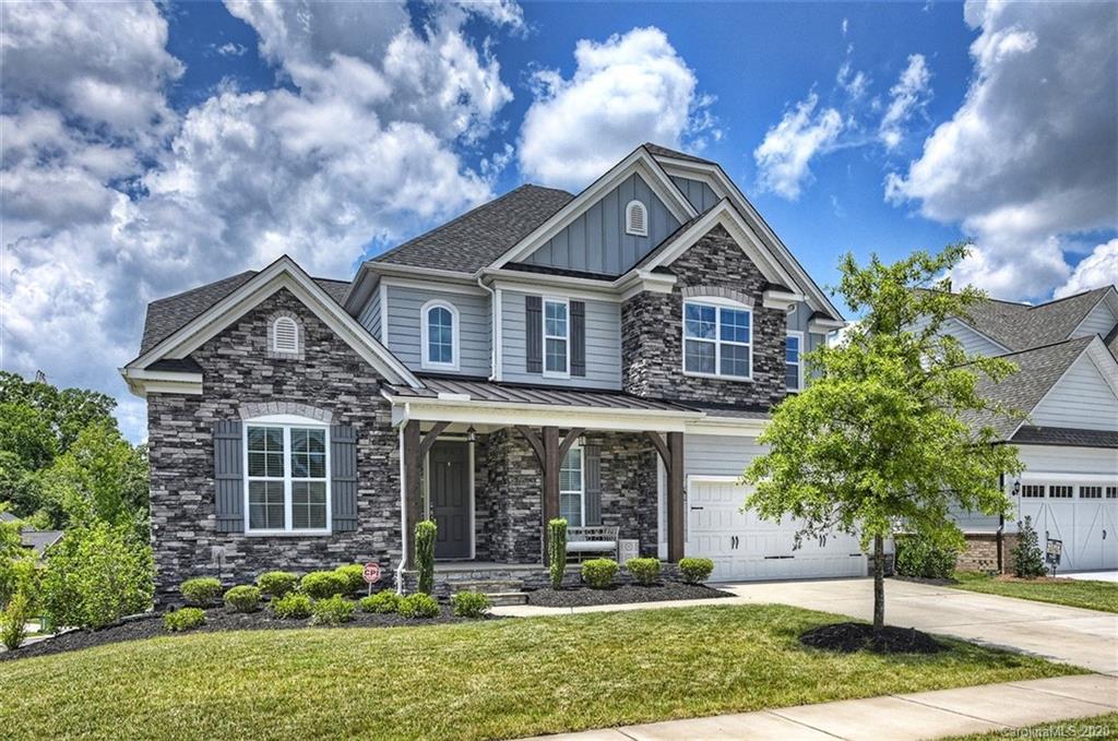 front view of a house with a yard