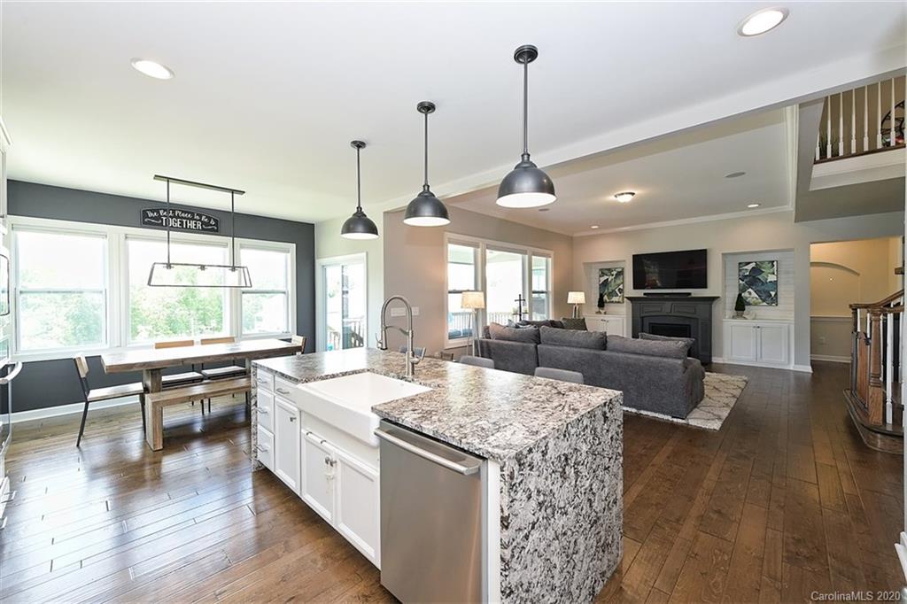 5321 Meadowcroft Way Fort Mill, SC 29708 - Photo 14 of 36 a large kitchen with kitchen island a large counter top space appliances and a living room view
