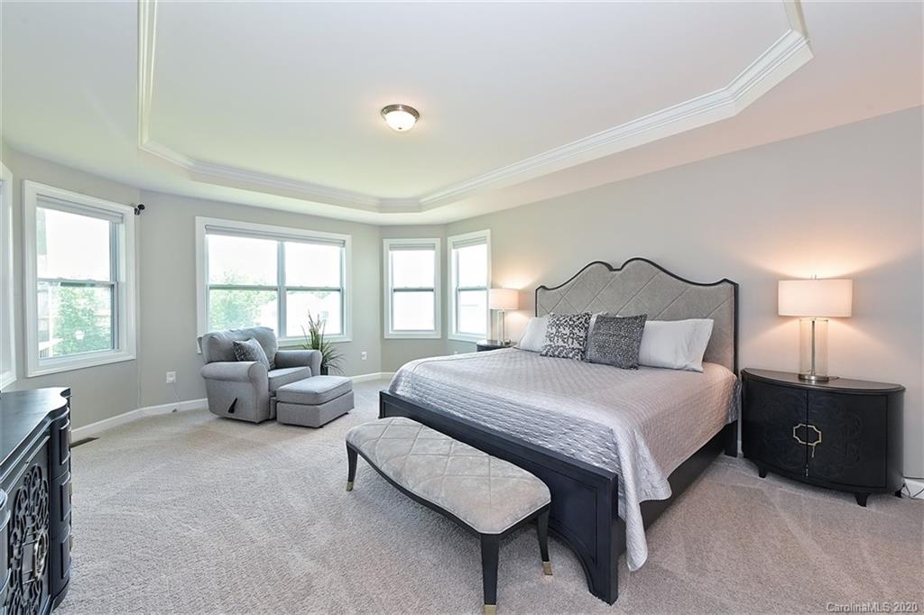 5321 Meadowcroft Way Fort Mill, SC 29708 - Photo 16 of 36 a bedroom with a bed and a couch
