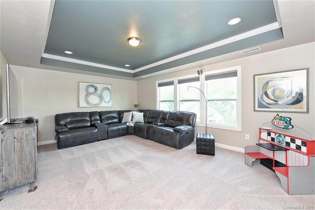 5321 Meadowcroft Way Fort Mill, SC 29708 - Photo 24 of 36 a living room with furniture fireplace and a large window