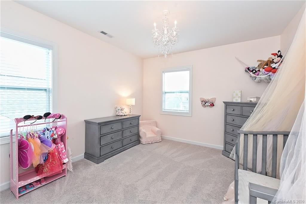 5321 Meadowcroft Way Fort Mill, SC 29708 - Photo 26 of 36 a bedroom with furniture and a window
