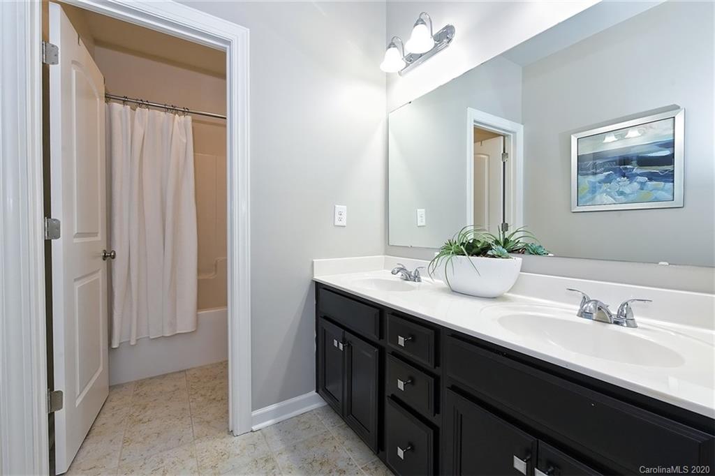 5321 Meadowcroft Way Fort Mill, SC 29708 - Photo 28 of 36 a bathroom with a double vanity sink and a mirror