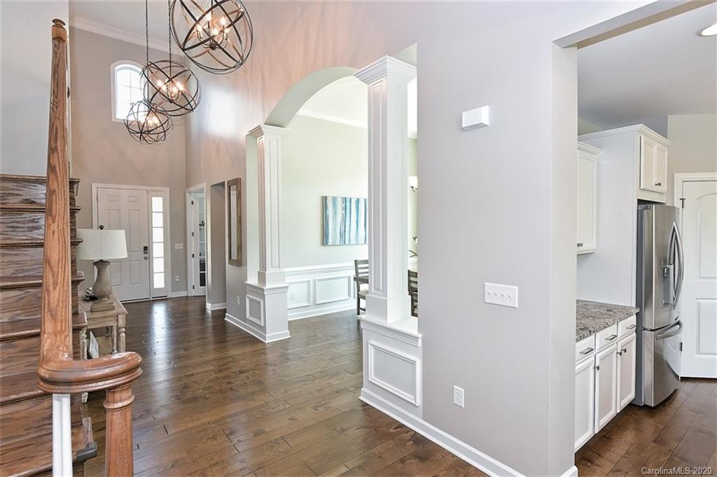 5321 Meadowcroft Way Fort Mill, SC 29708 - Photo 4 of 36 a view of a hallway to a livingroom with furniture and windows