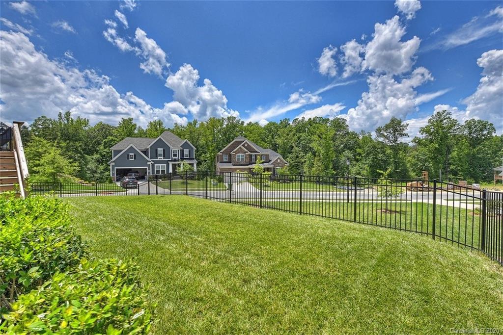 5321 Meadowcroft Way Fort Mill, SC 29708 - Photo 34 of 36 a view of a house with a backyard and a tree