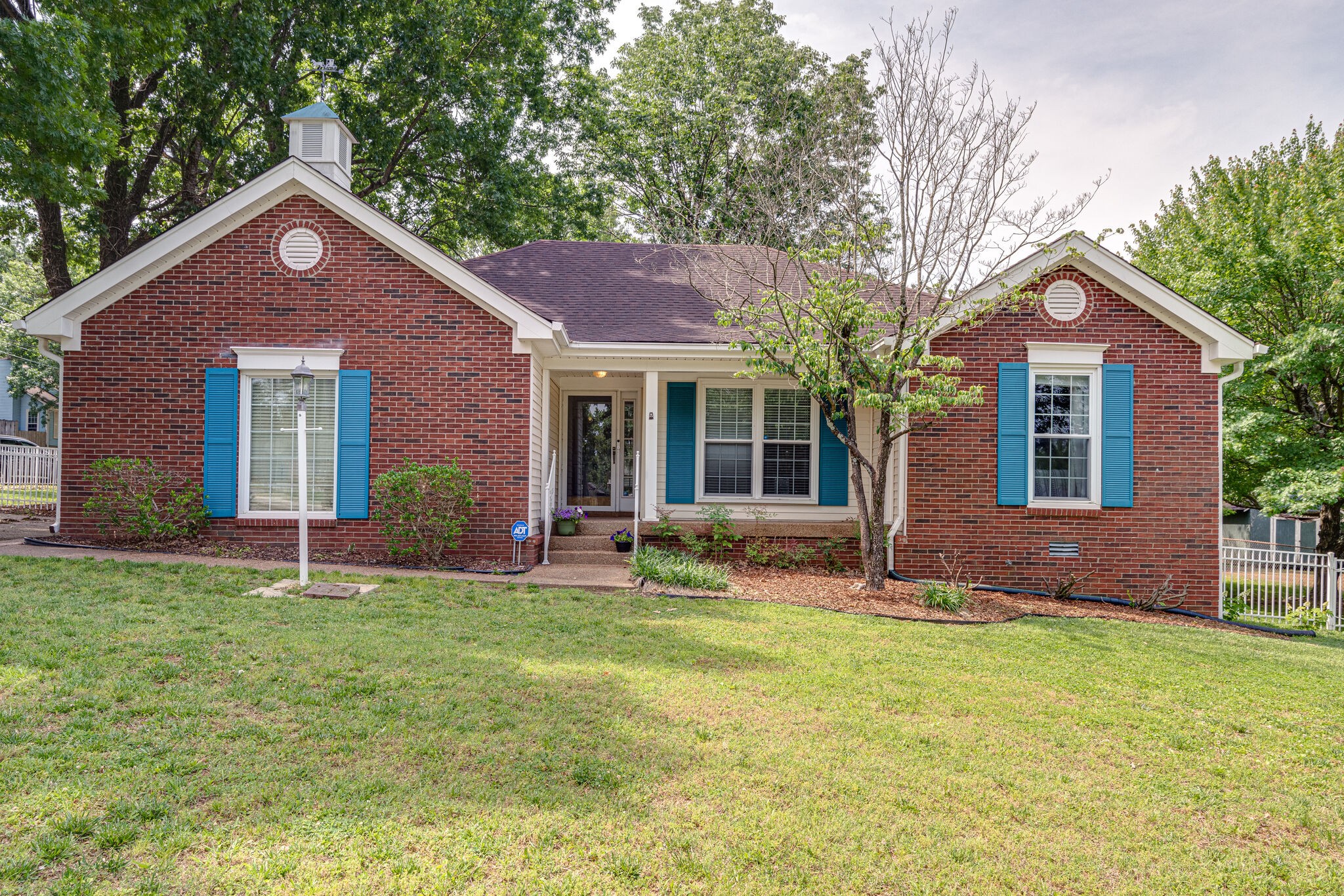 385 Cedarcliff Road Antioch, TN 37013 - Photo 1 of 29 a front view of a house with garden and yard