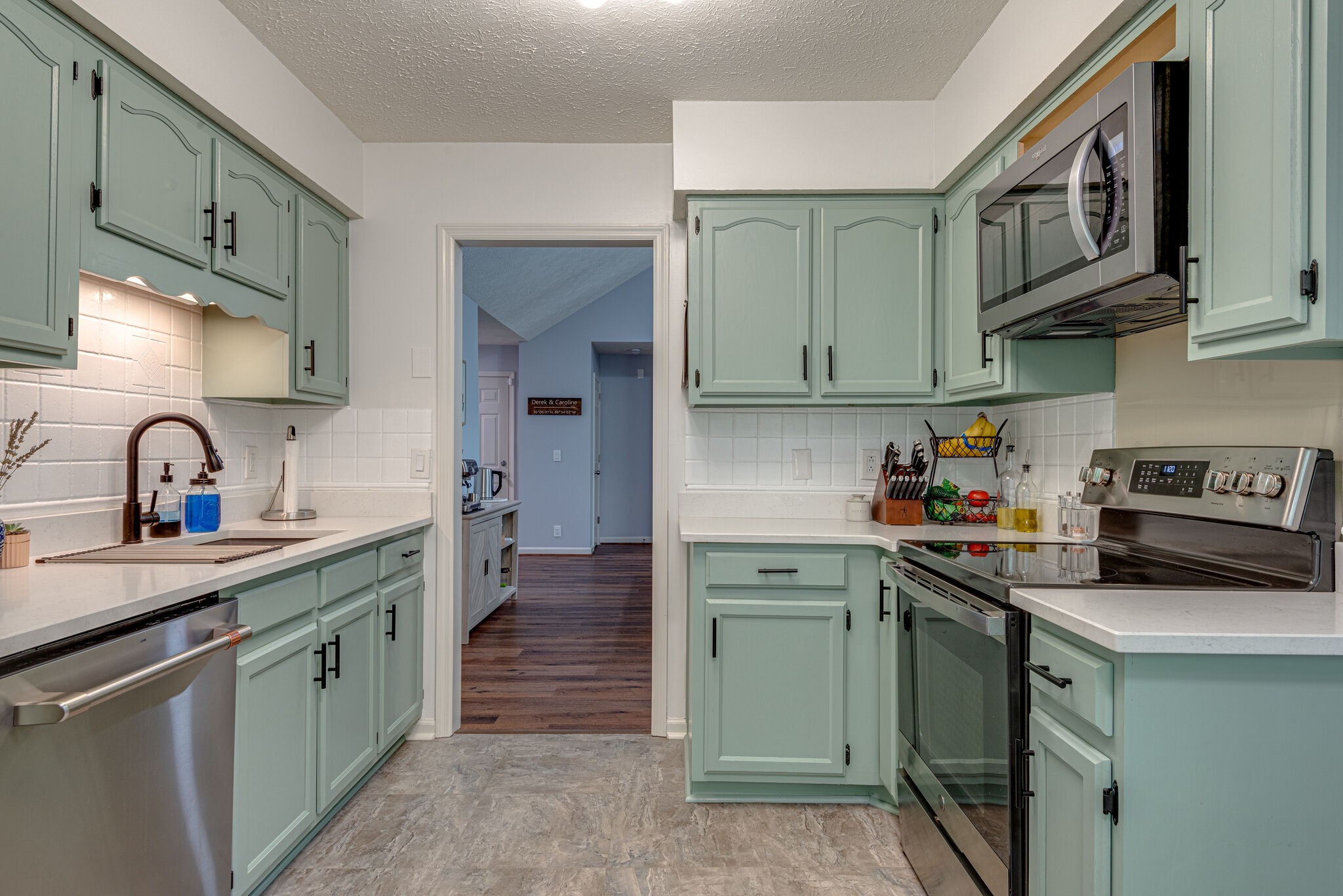 385 Cedarcliff Road Antioch, TN 37013 - Photo 12 of 29 a kitchen with stainless steel appliances granite countertop a sink stove and cabinets