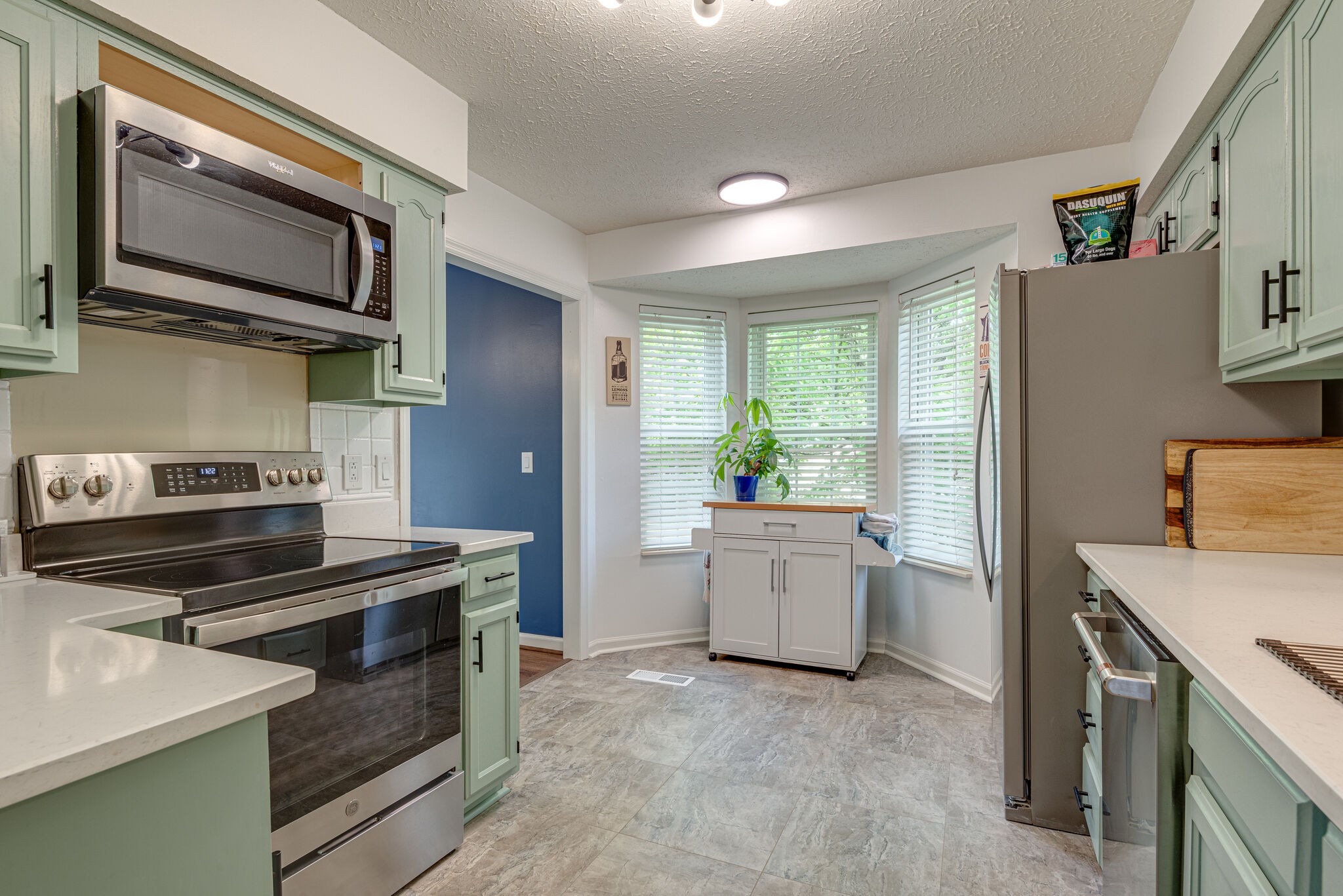 385 Cedarcliff Road Antioch, TN 37013 - Photo 13 of 29 a kitchen with a stove microwave and refrigerator