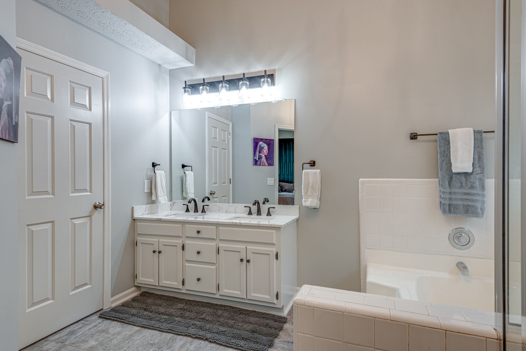 385 Cedarcliff Road Antioch, TN 37013 - Photo 19 of 29 a bathroom with a double vanity sink mirror and shower