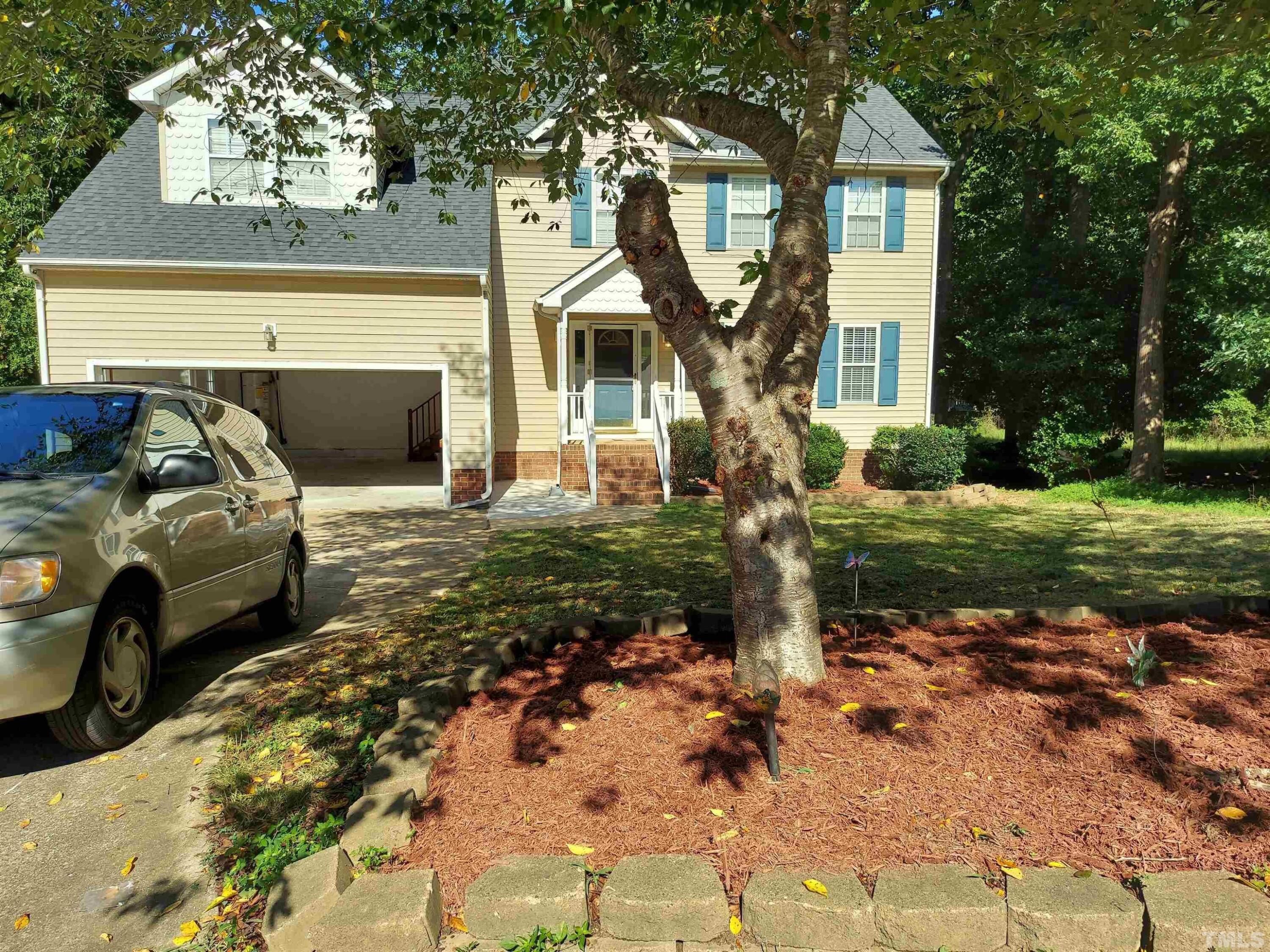 224 Crossfire Road Holly Springs, NC 27540 - Photo 2 of 43 a front view of a house with garden