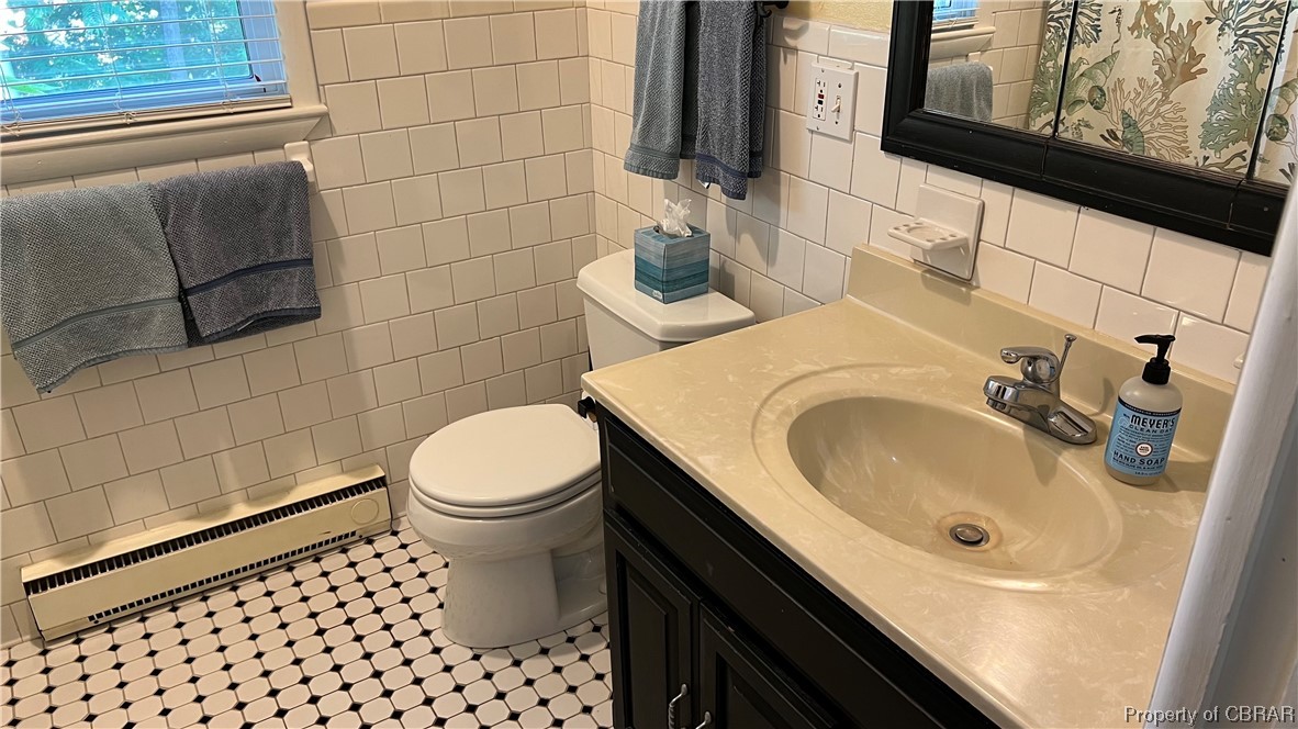 88 Leachwood Road Lancaster, VA 22503 - Photo 41 of 49 a bathroom with a sink a toilet and mirror