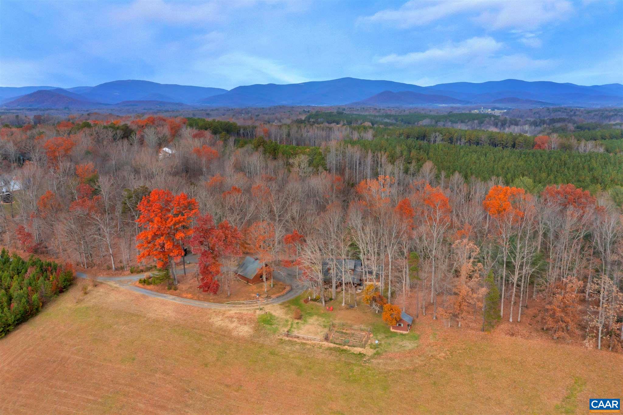 1054 Durrett Ridge Road Earlysville, VA 22936 - Photo 4 of 44 a view of a lake with a mountain